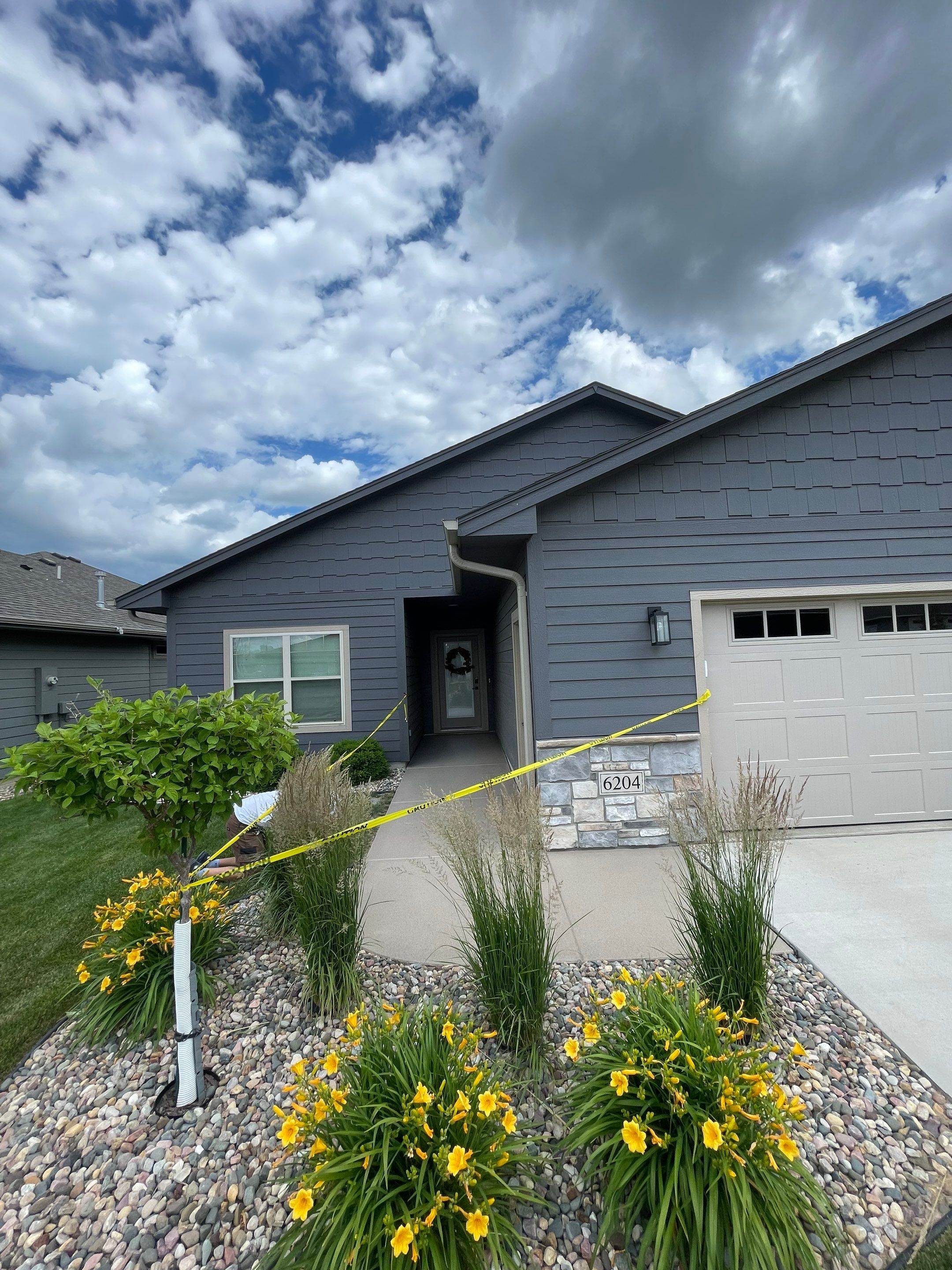 Textured Concrete Patio Coating and Custom Privacy Pergola in Sioux Falls by Select Painting, Coatings & Garage Cabinets