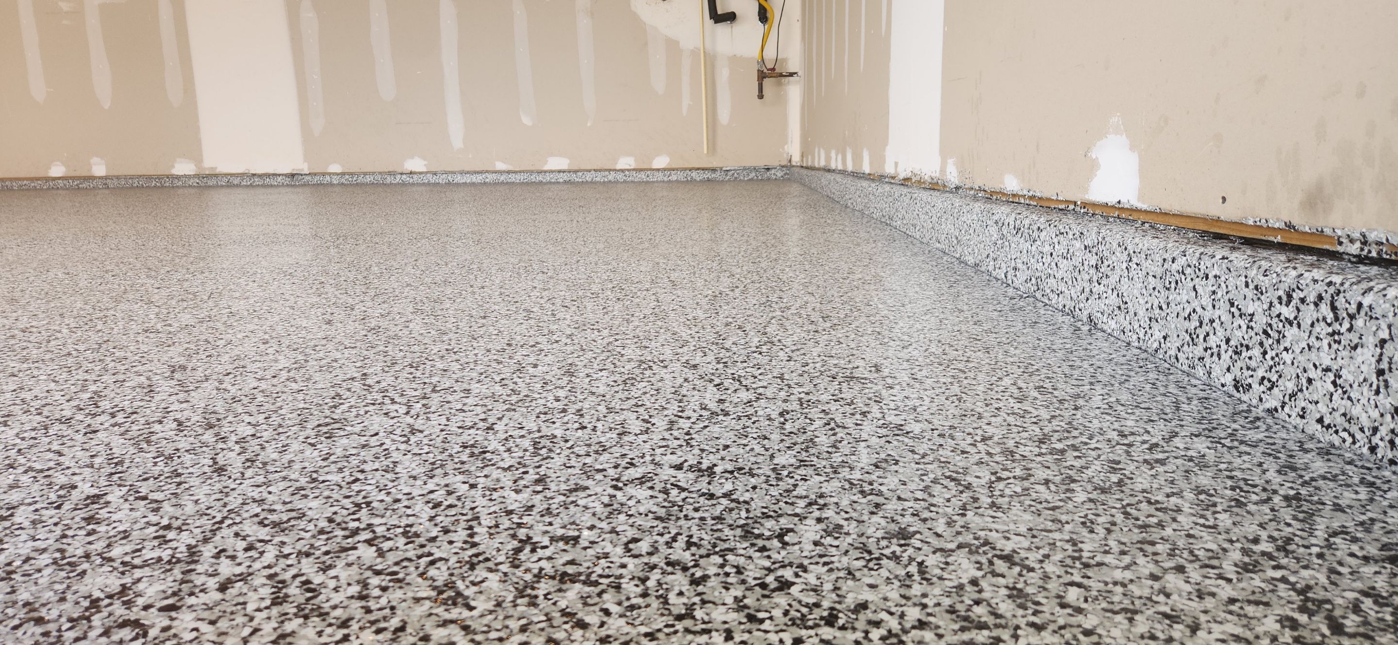 Garage & Back Patio using Domino & Pumice by Elite Floor Solutions