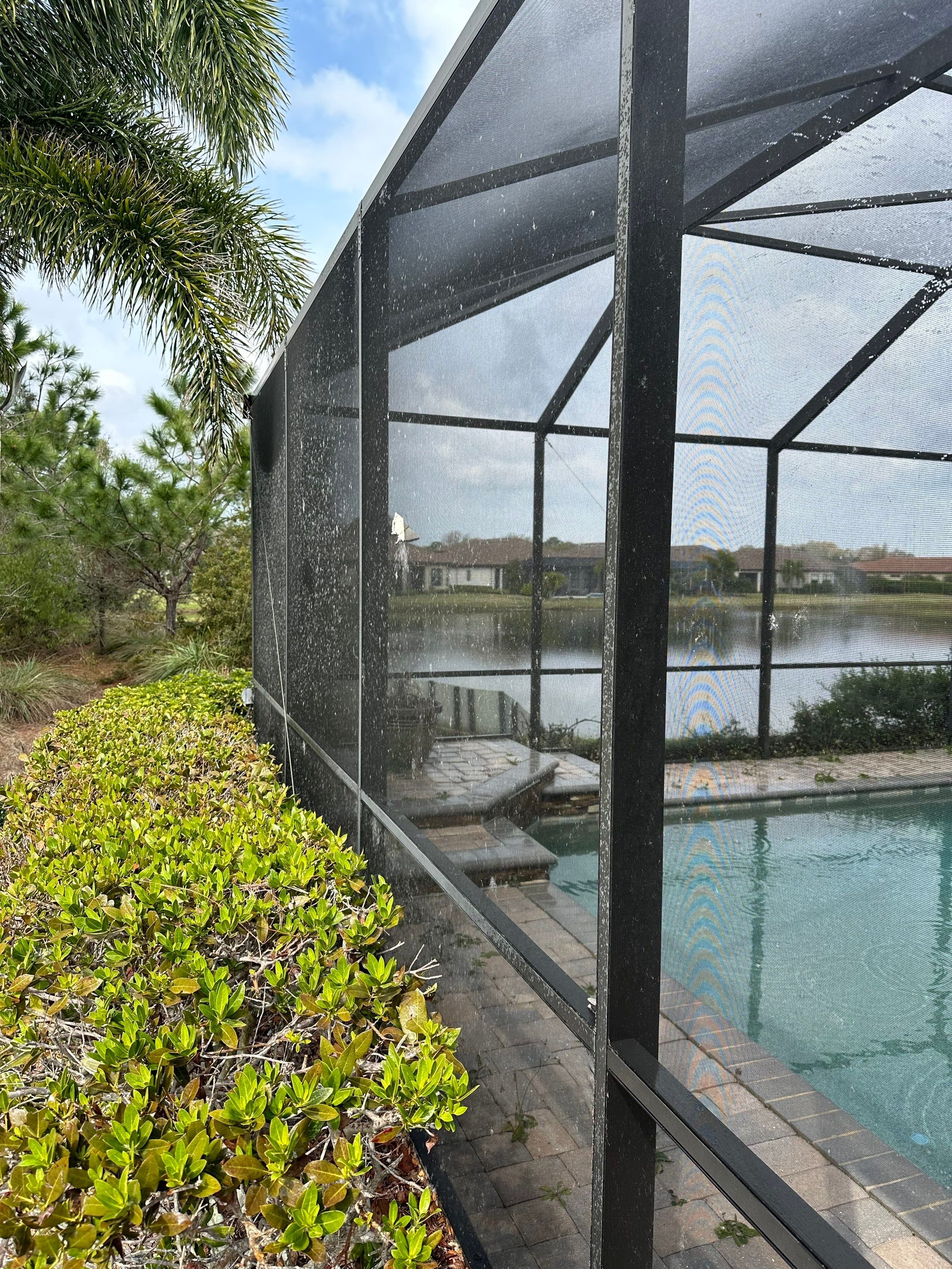 Concrete Tile Roof, Paver Pool Deck, Screen Enclosure & Driveway Cleaning in Artisan Lakes Esplanade, Palmetto, FL | Sunshine AquaWash by Sunshine AquaWash