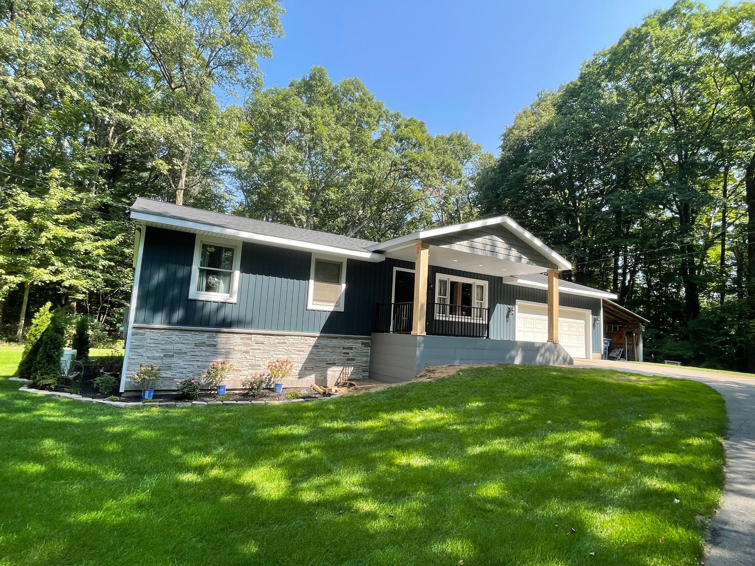 Siding, Deck and Versetta Stone by Avalon Roofing and Exteriors