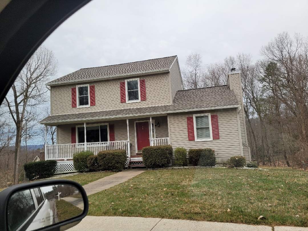 Replacement front porch using Trex Tropical Island mist and White composite railings. Includes lattice bottom. by DiGiorgi Roofing and Siding Inc