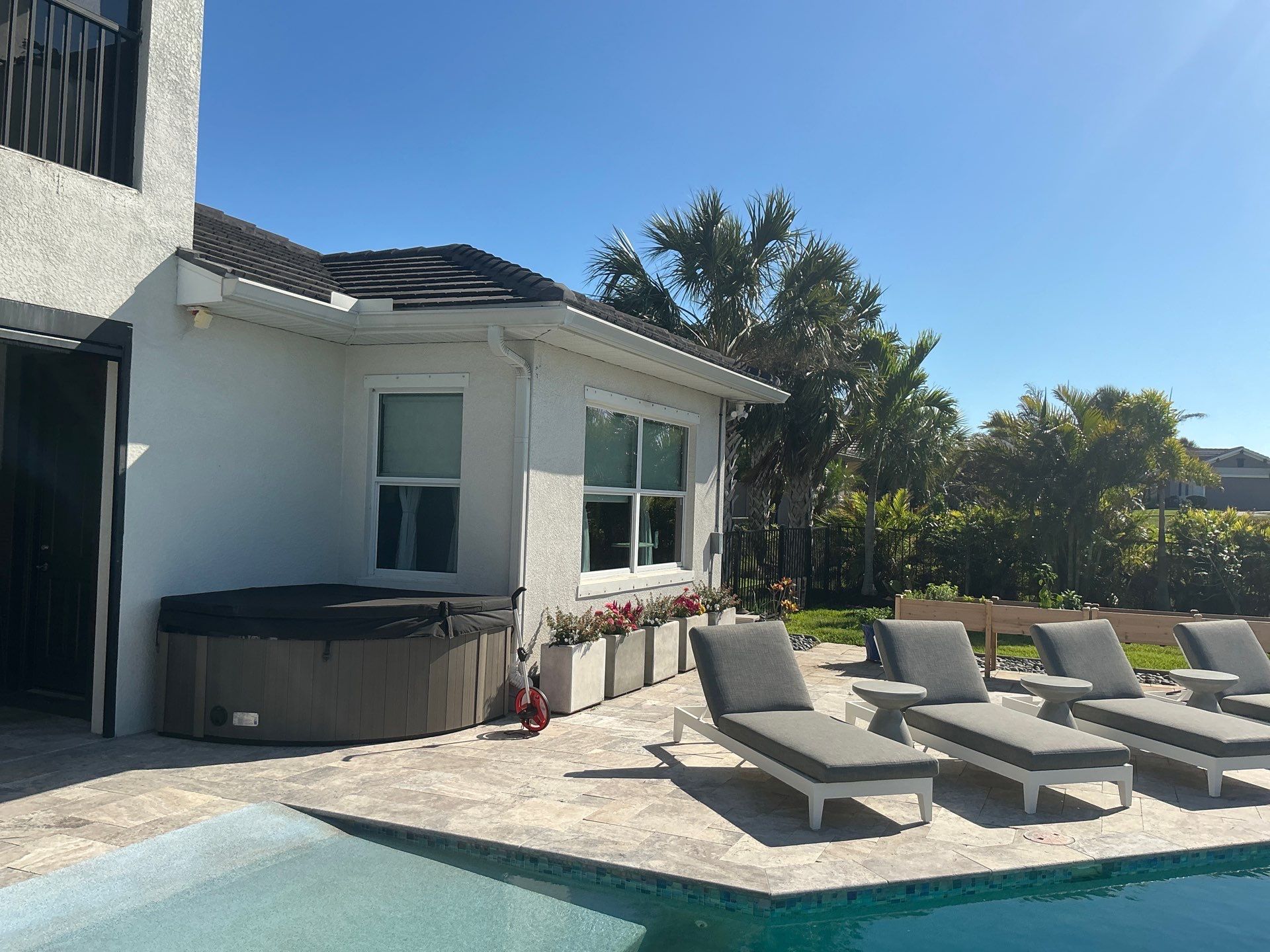 White Seamless Gutters with Downspouts in Bradenton FL by Gutter Professors