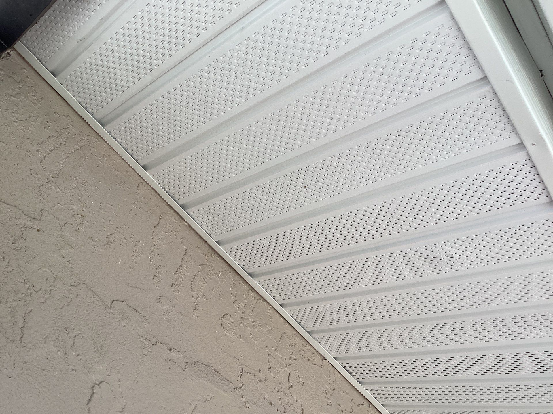 White Seamless Gutters and Splash Guards in Fort Myers FL by Gutter Professor by Gutter Professors