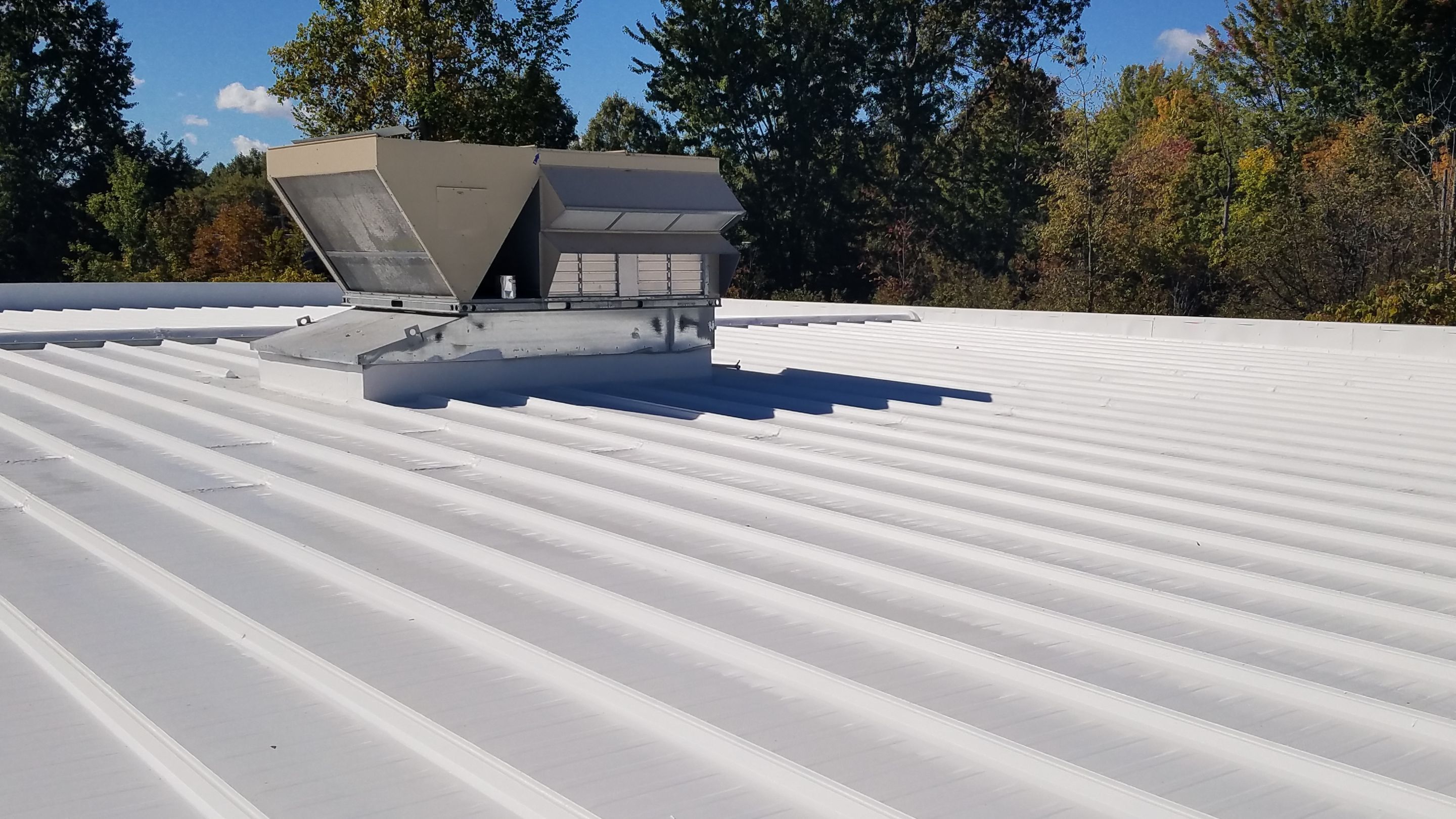 Commercial Metal Roof Coating by Gold Star Roofing LLC