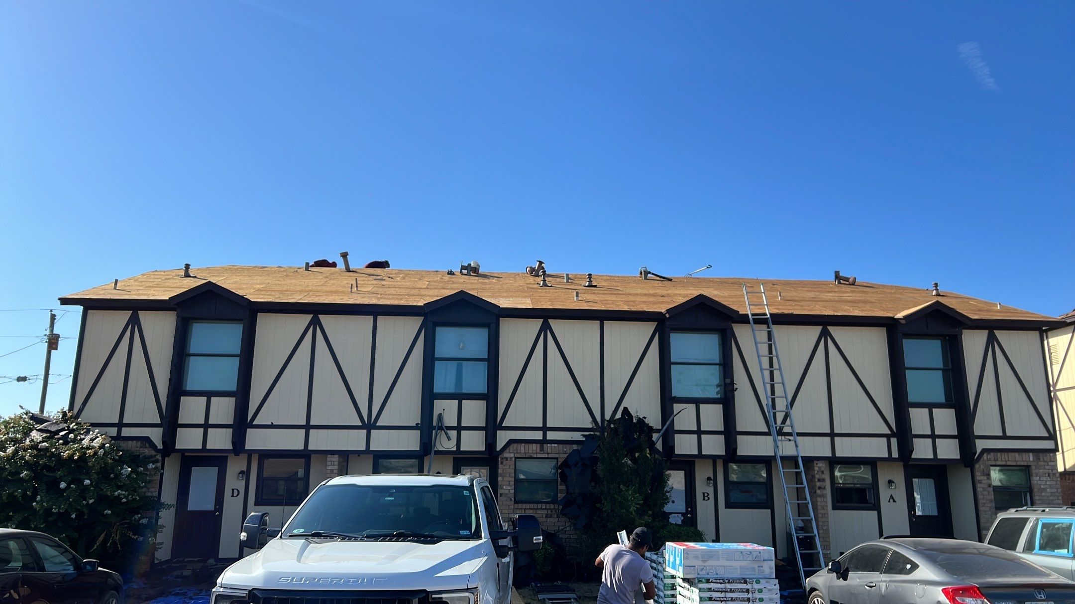 Commercial Roofing Installation using ATLAS Pinnacle Pristine Shingles by Harvey Roofing & Construction
