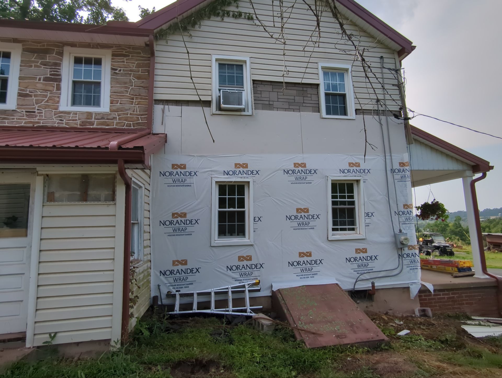 Metal Roof-coloniel red- and new siding by Esh Builders