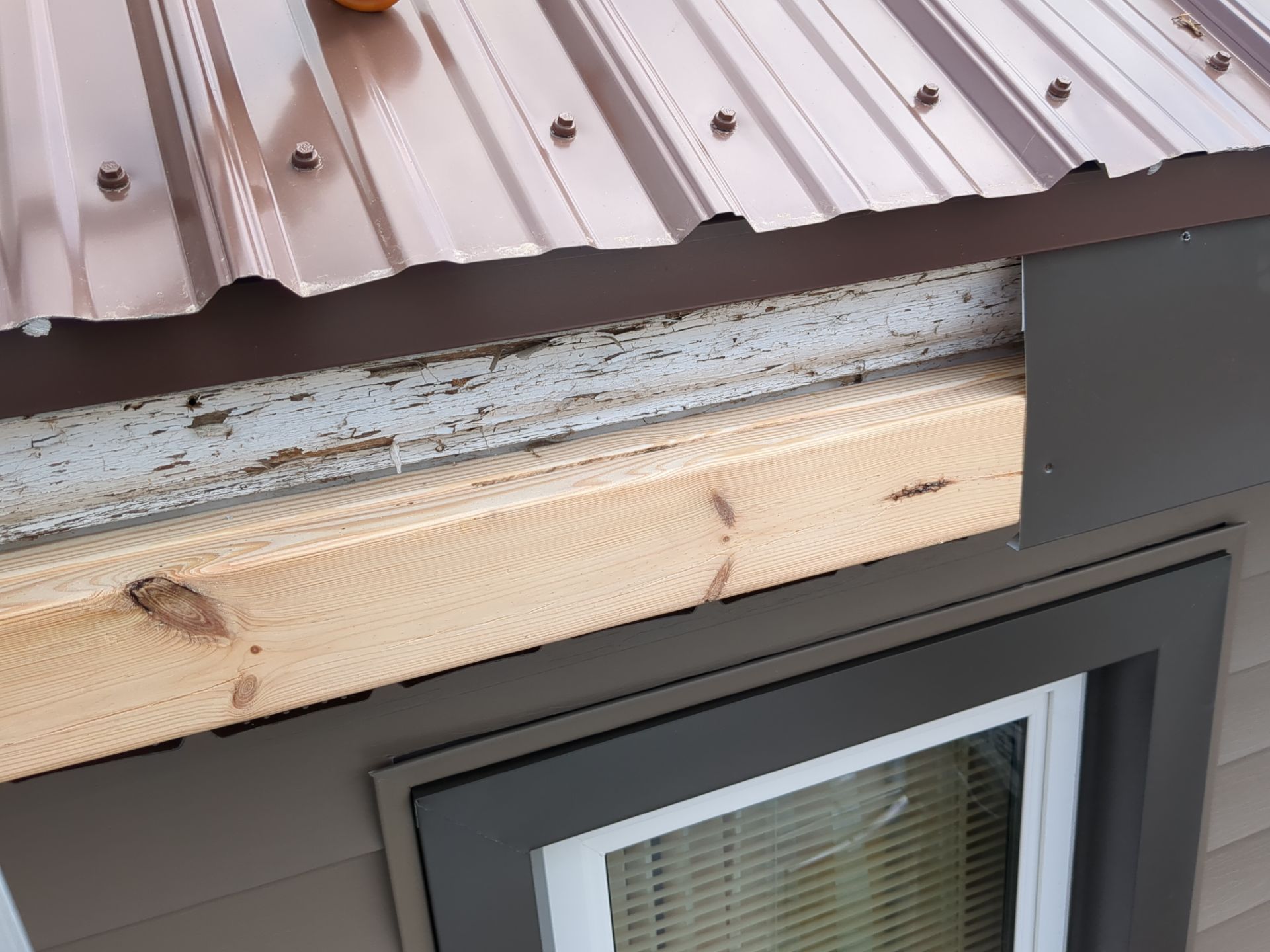 Exterior Renovation with Vinyl Siding, Metal Roof & Spouting  by Esh Builders
