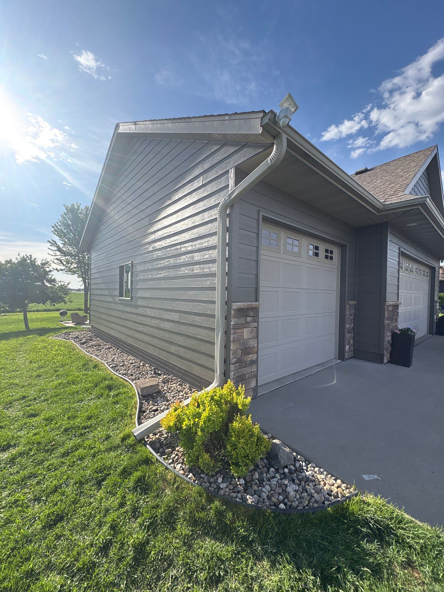 Sioux Falls Residential Exterior Refresh with Fiber Cement Siding by Select Painting, Coatings & Garage Cabinets