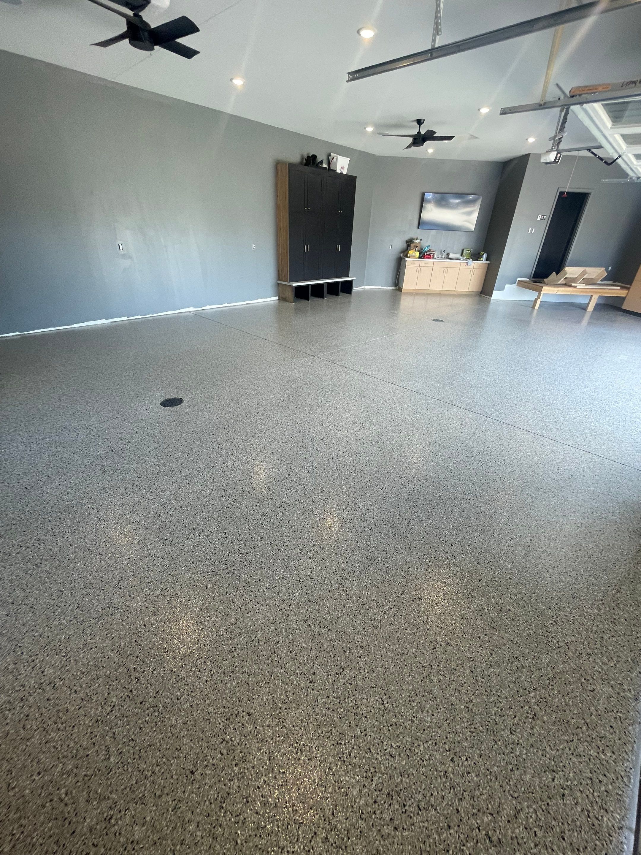 Custom Speckled Concrete Coating for Dell Rapids Garage by Select Painting, Coatings & Garage Cabinets