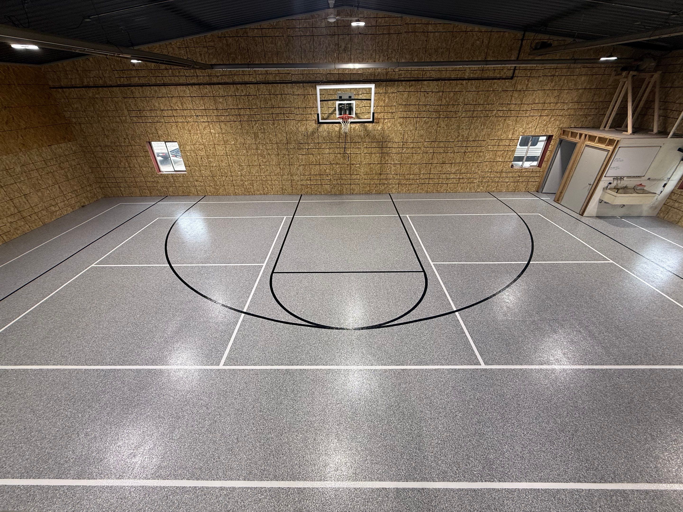 Custom Polyurea Shop Floor with Basketball Court Lines in Rock Valley by Select Painting, Coatings & Garage Cabinets