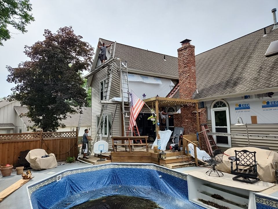 All New Craneboard D7 siding and New prefinished front door   by EEC  Windows, Siding & Roofing 