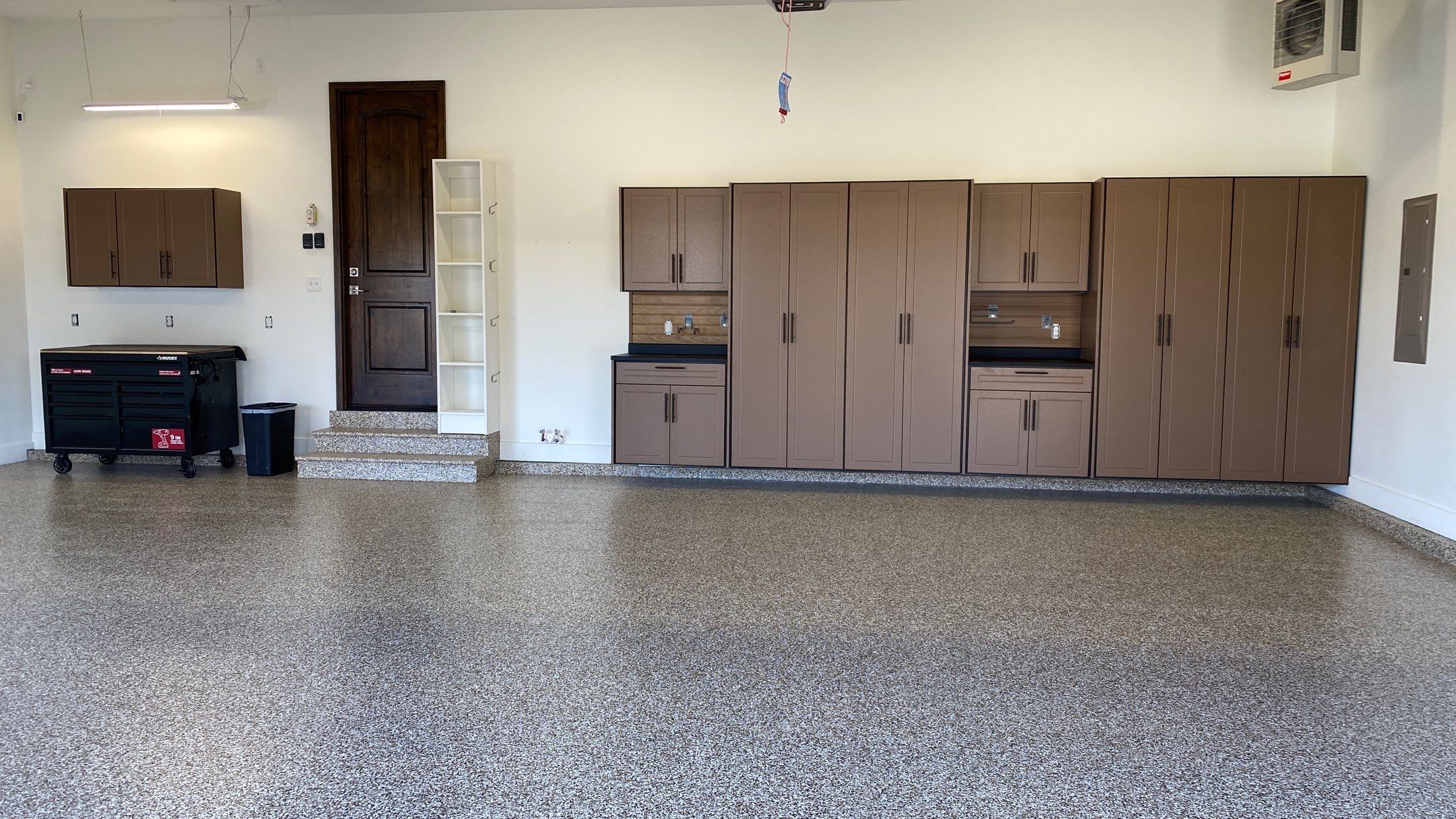 Kenny & Debbie transformed their garage with a Banner Garage Floor and cabinets by Banner Garage