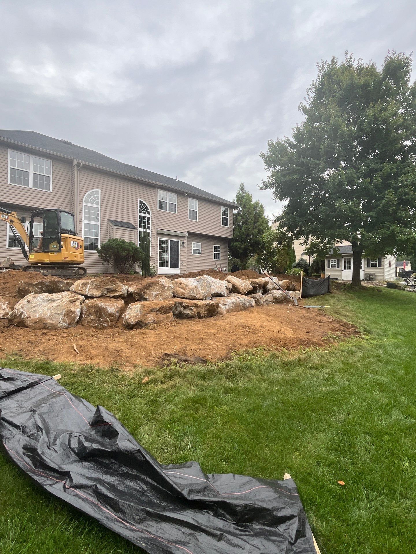 Backyard Retreat: Techo-Bloc Patio + Firepit Lounge by Saylor’s Lawn & Landscape