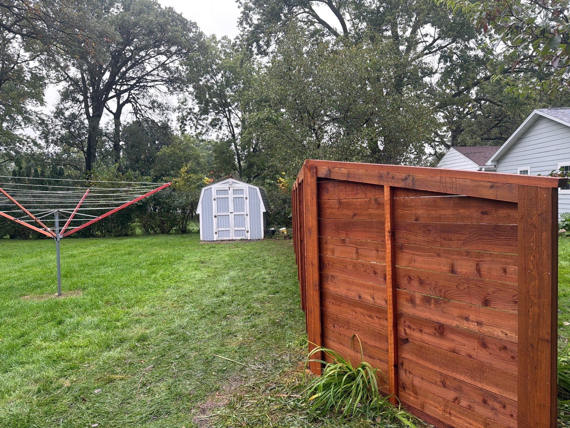 Stained Horizontal Cedar Wood Privacy Fence in Cedar Falls by Perfect Picket Fence and Stain