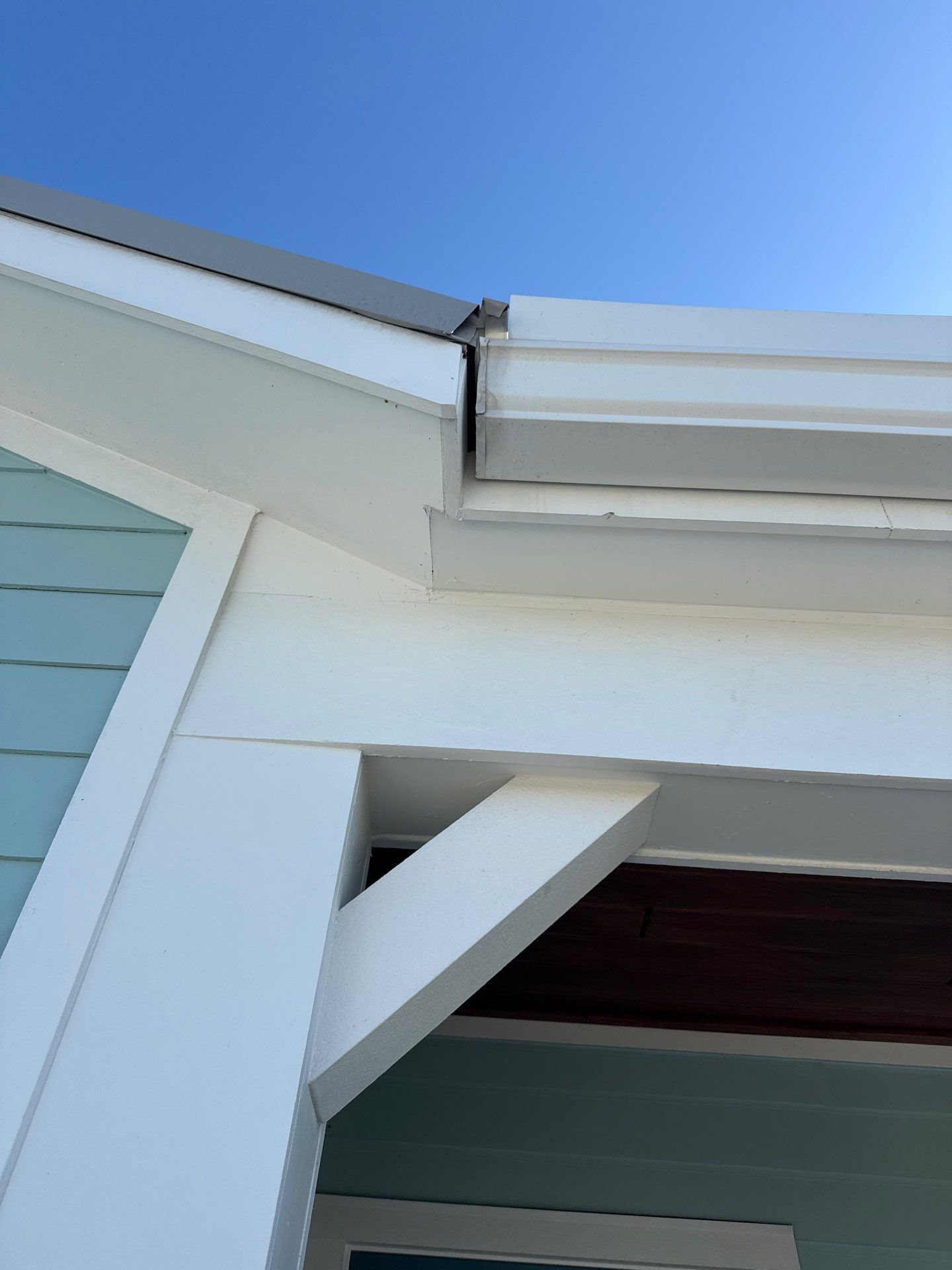 New White Seamless Gutters Installation and Downspouts, Reseal Gutters in Fort Myers Beach, FL  by Gutter Professors