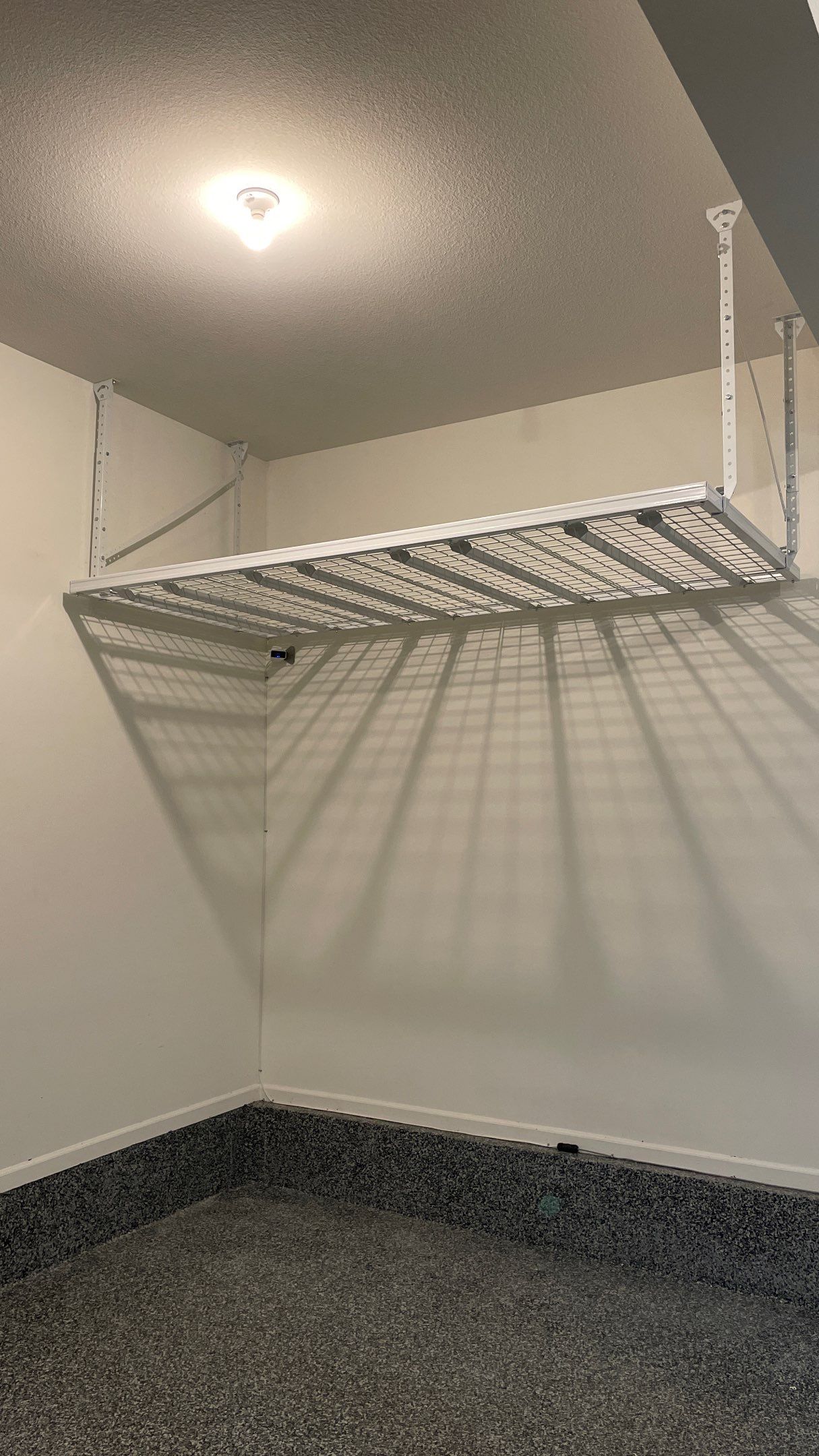 Stacy T. adds ceiling racks to garage for extra storage!  by Banner Garage