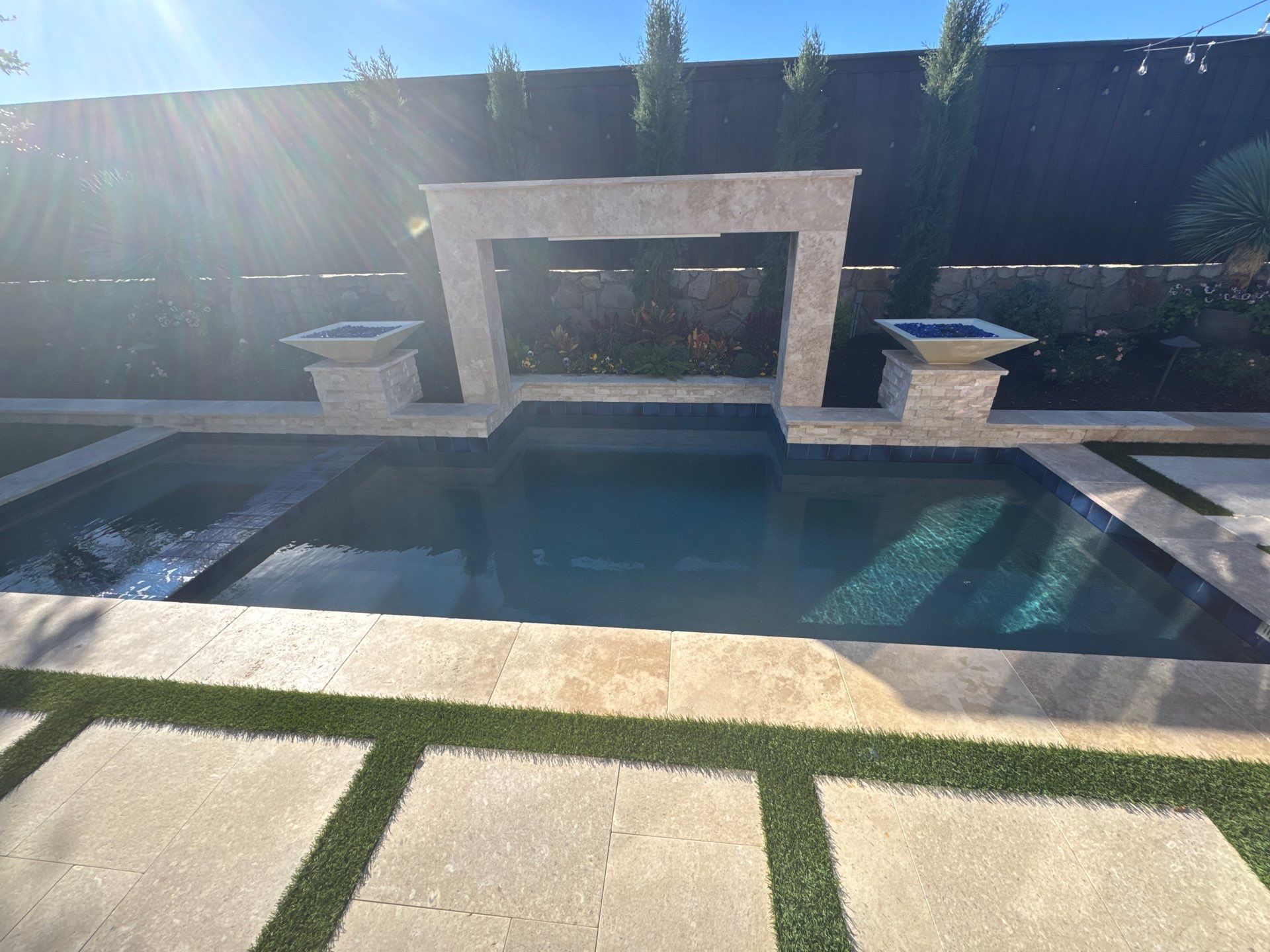 Modern Pool with Raised Water Feature Wall by Pinnacle Pools and Spas - DFW