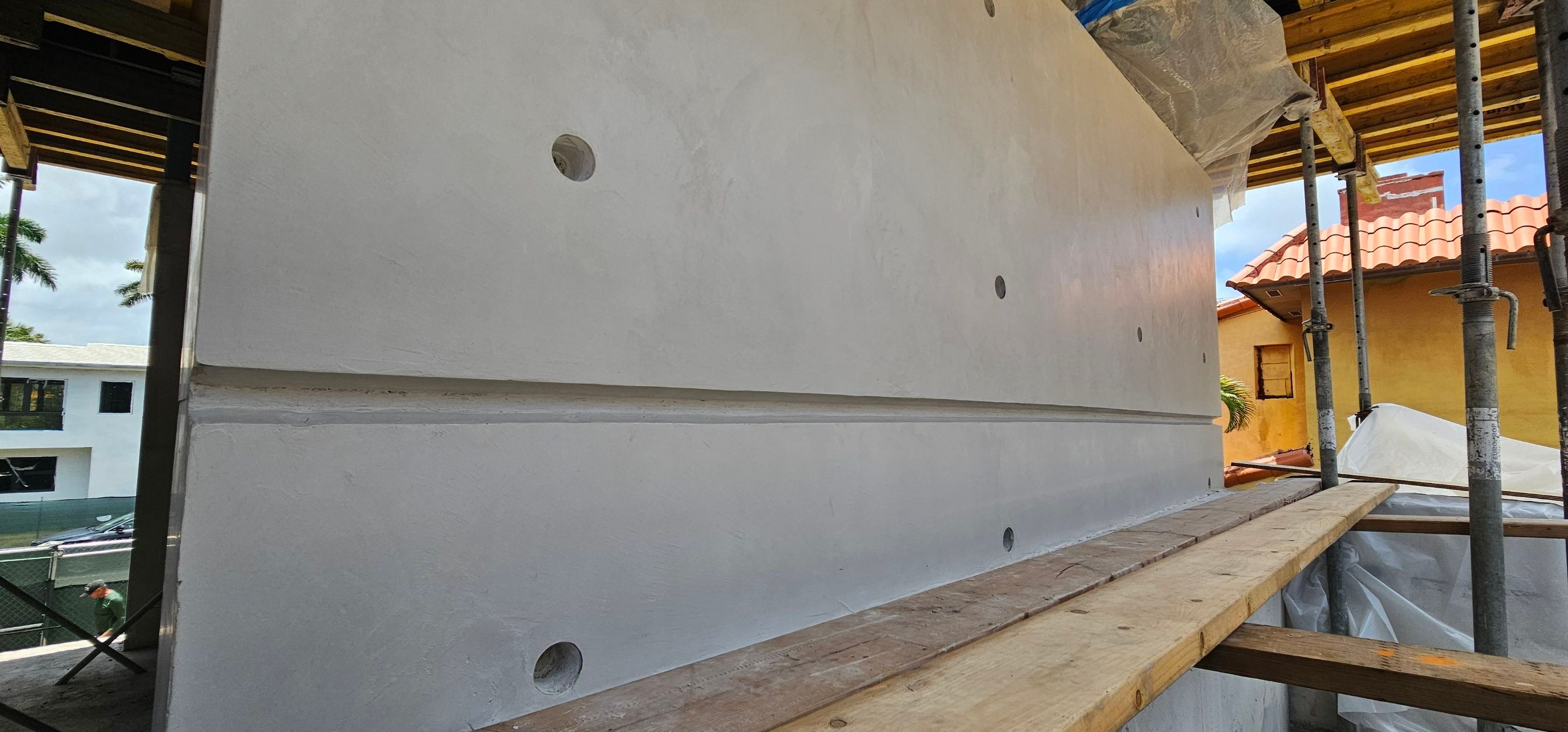 Microtopping over Exterior Walls by Seamless Surfaces