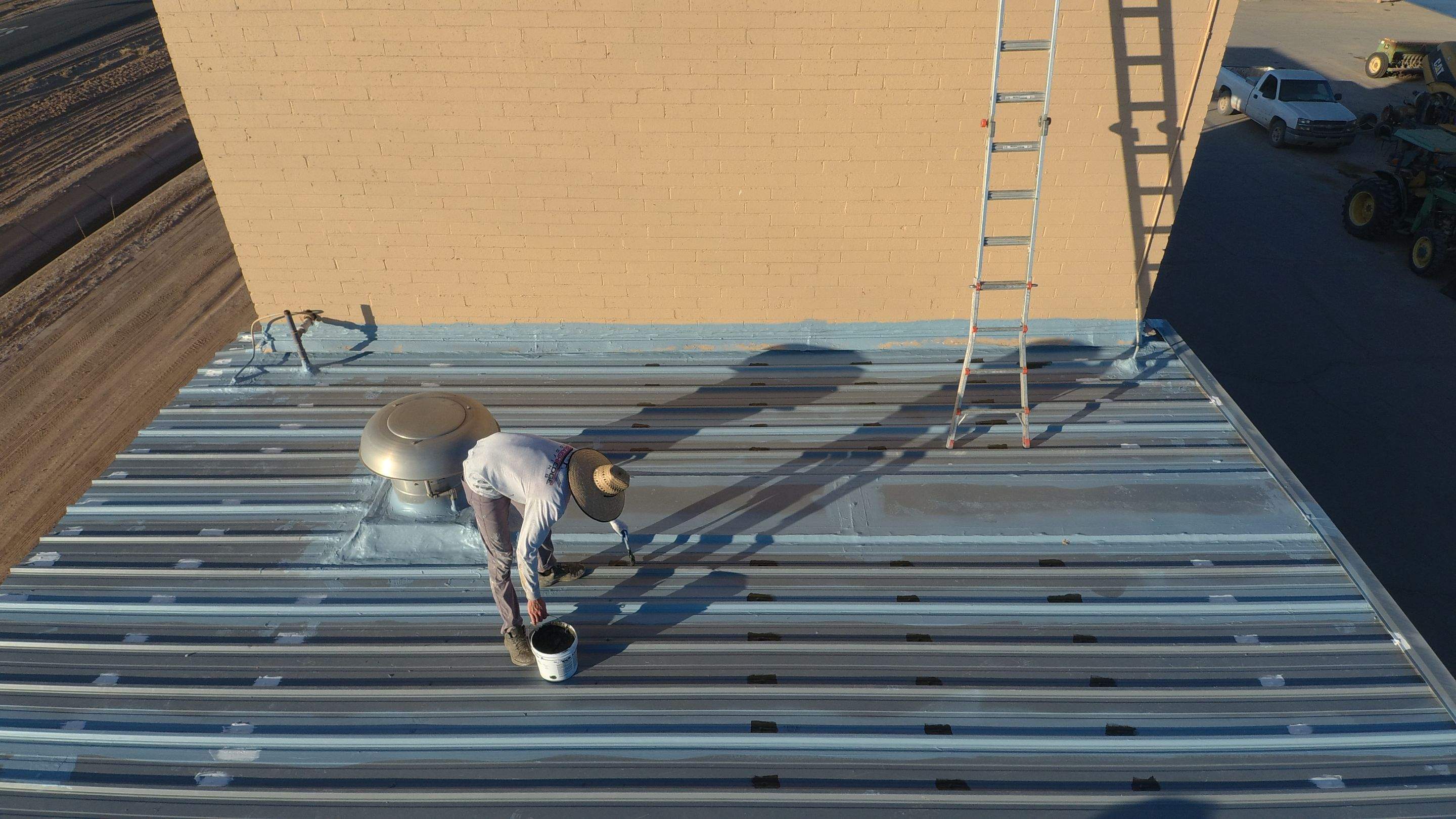 Metal roof restoration on commercial roof using Conklin Benchmark/PUMA XL fabric and coating by Straight Edge Roofing Inc