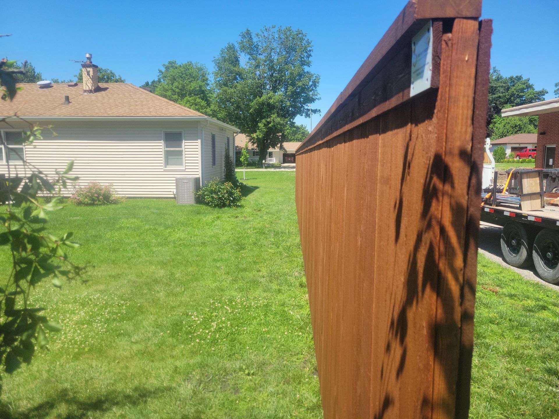 Custom Stained Cedar Chestnut Privacy Fence Installation in Cedar Falls by Perfect Picket Fence and Stain