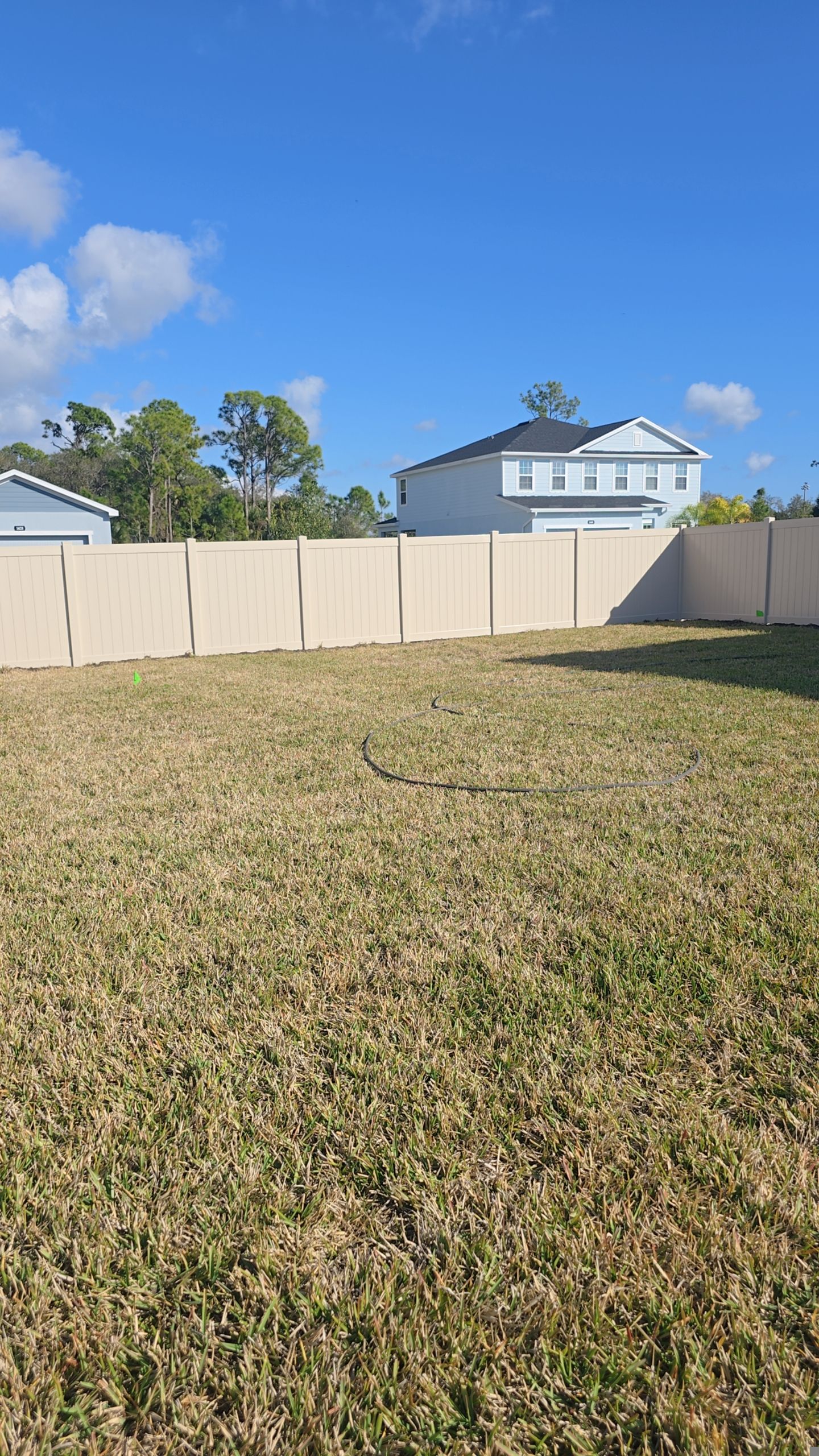 Tan Vinyl Fence in West Port by True Fence LLC