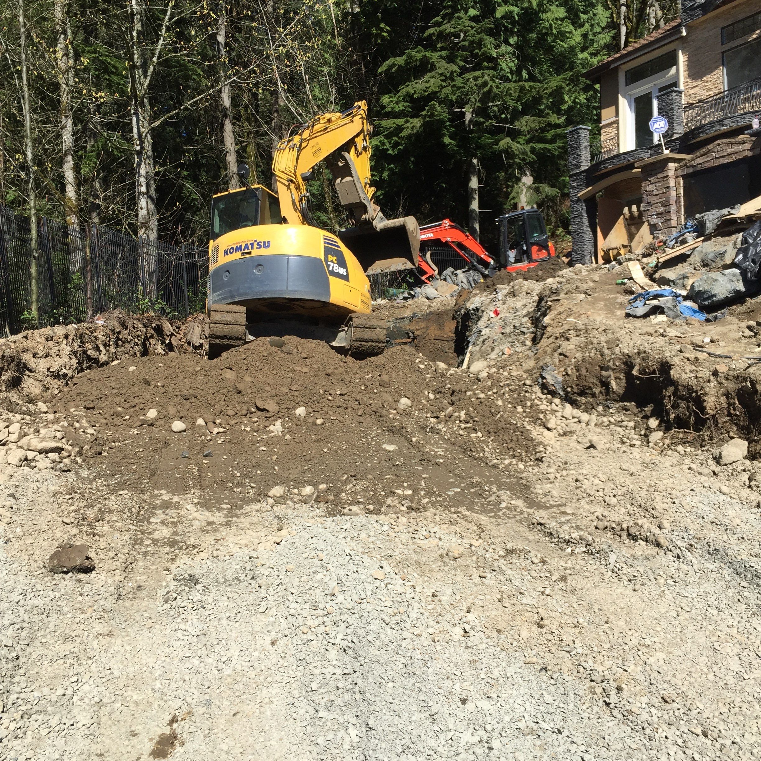 Asphalt Driveway and Stamped Concrete Patio Finish  by Jireh Asphalt & Concrete Inc 