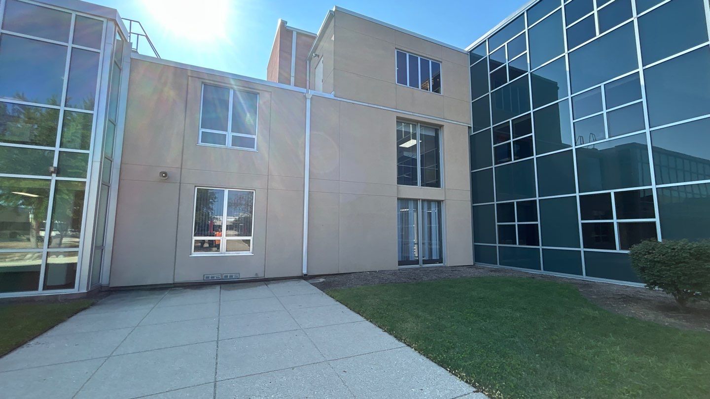 concrete using Algaecide, soft wash soap by Northern Power Washing LLC.
