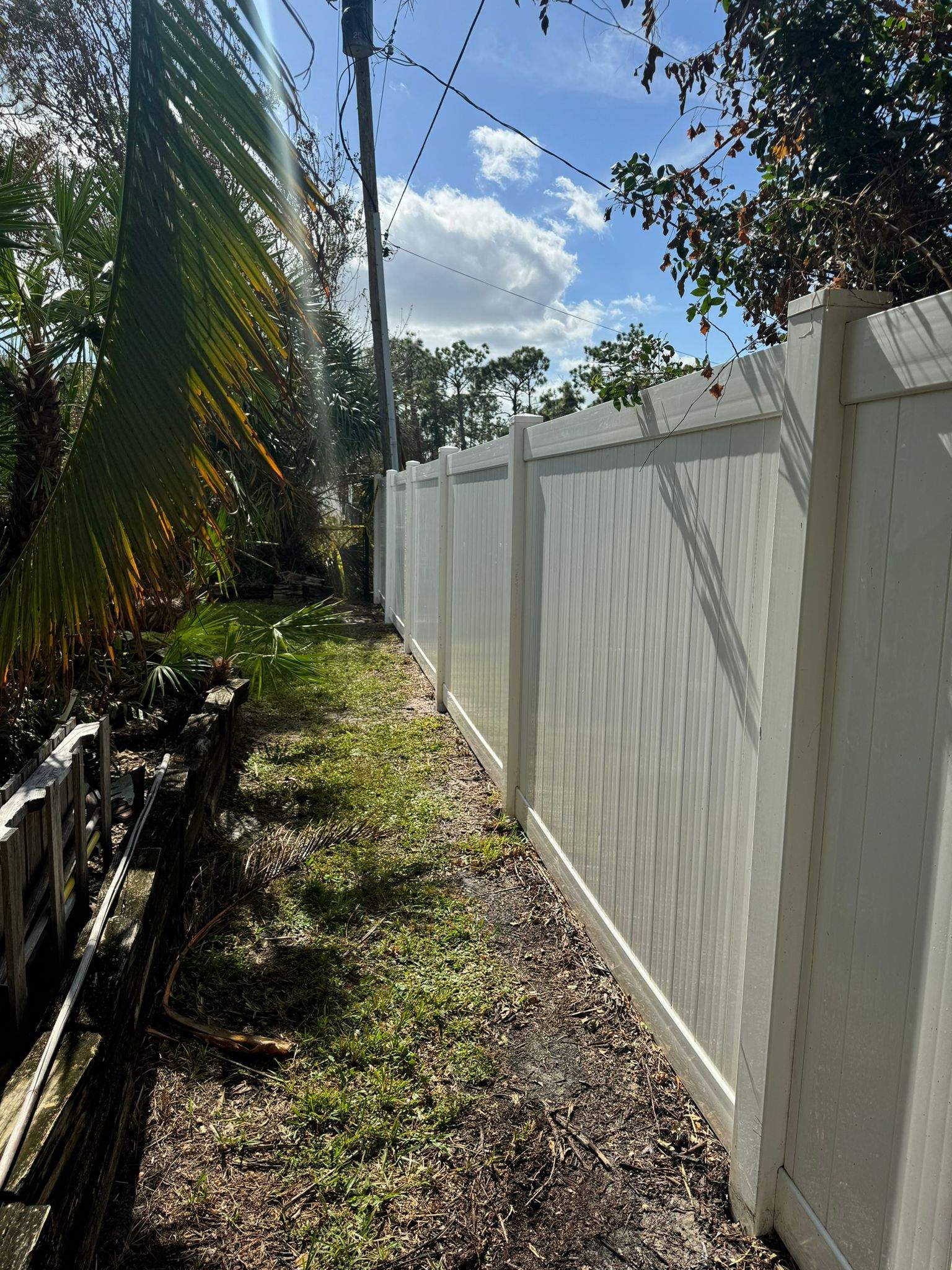 White Vinyl Privacy Fence Installation in Port Charlotte by True Fence LLC