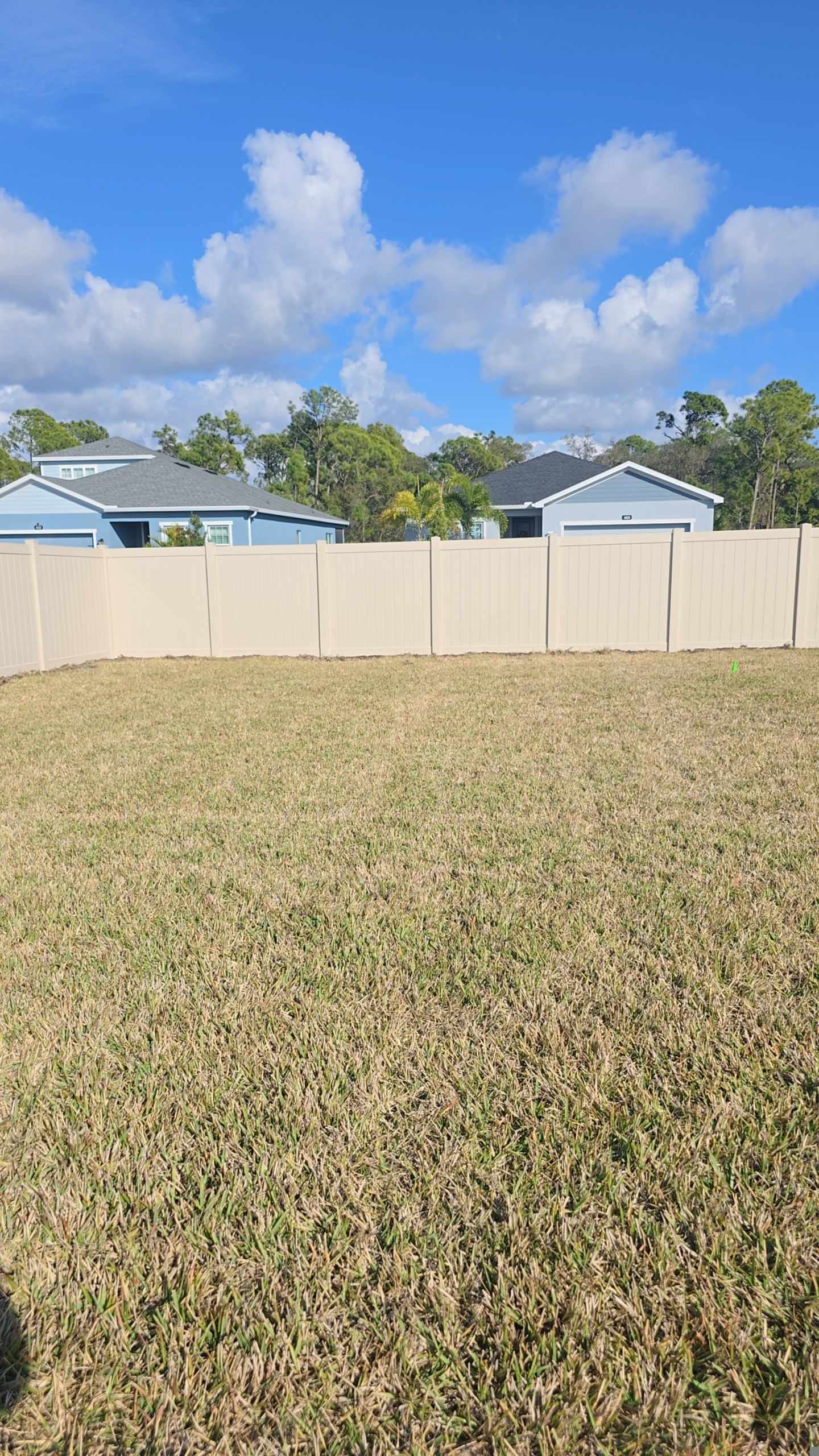 Tan Vinyl Fence in West Port by True Fence LLC