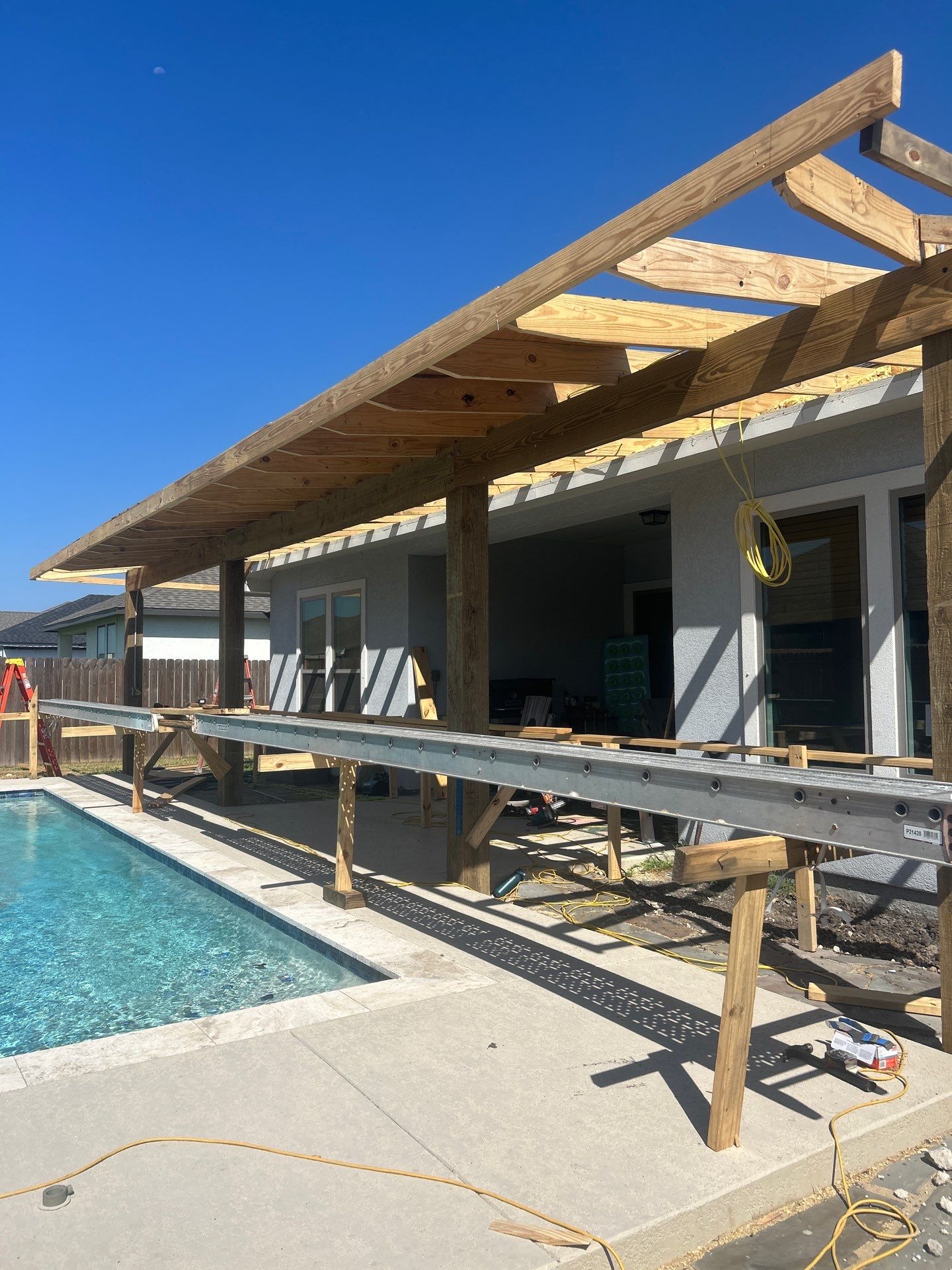 Patio Pool Cover by Bayfront Roofing and Construction