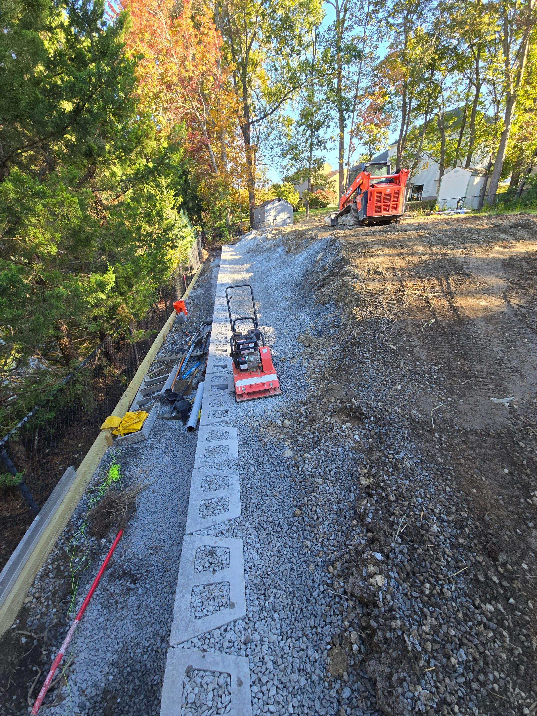 Retaining Wall to Level Backyard  by May Property Management 