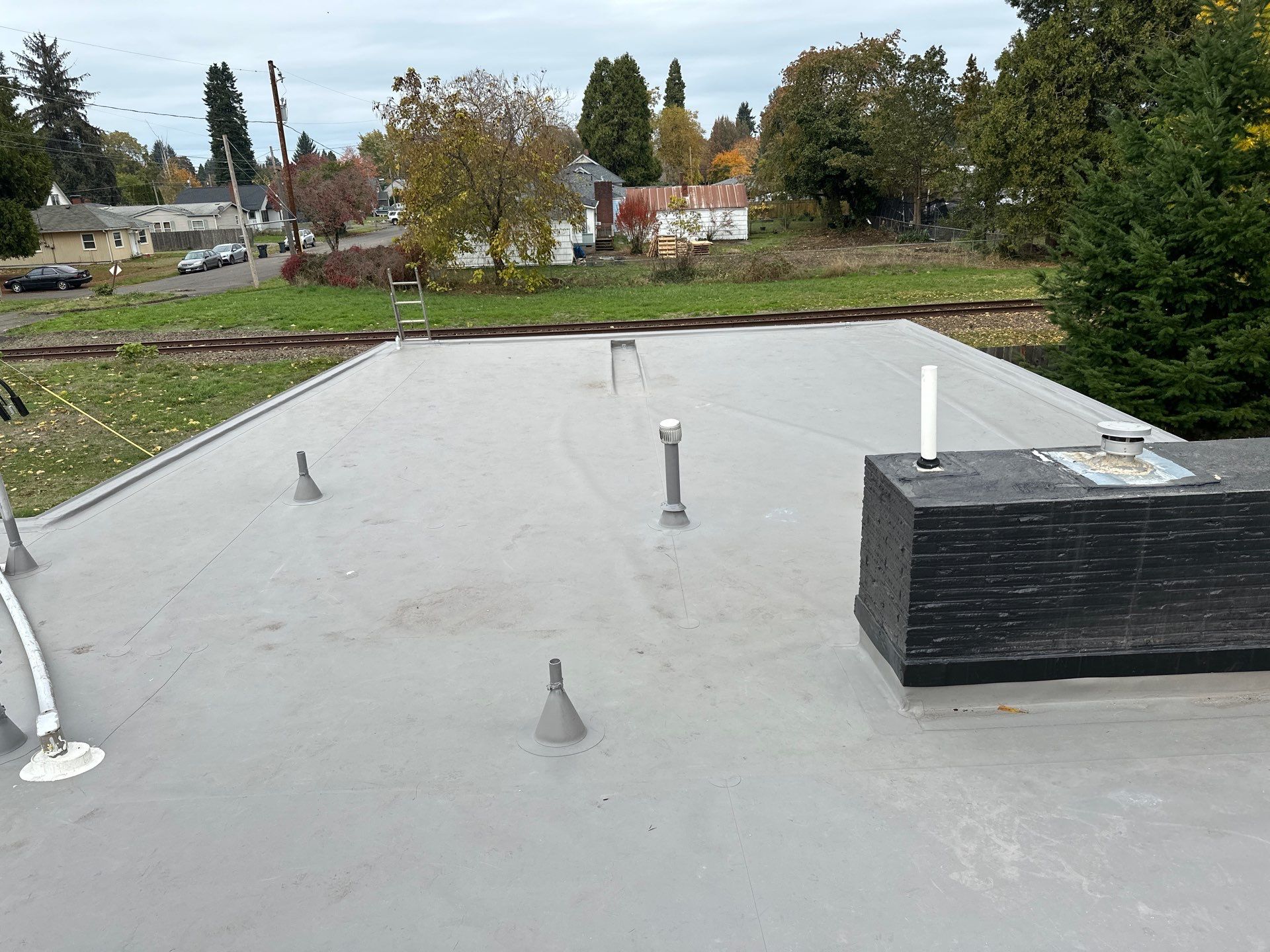 Residential Membrane Roof Replacement by Orezona Building & Roofing Company, Inc.