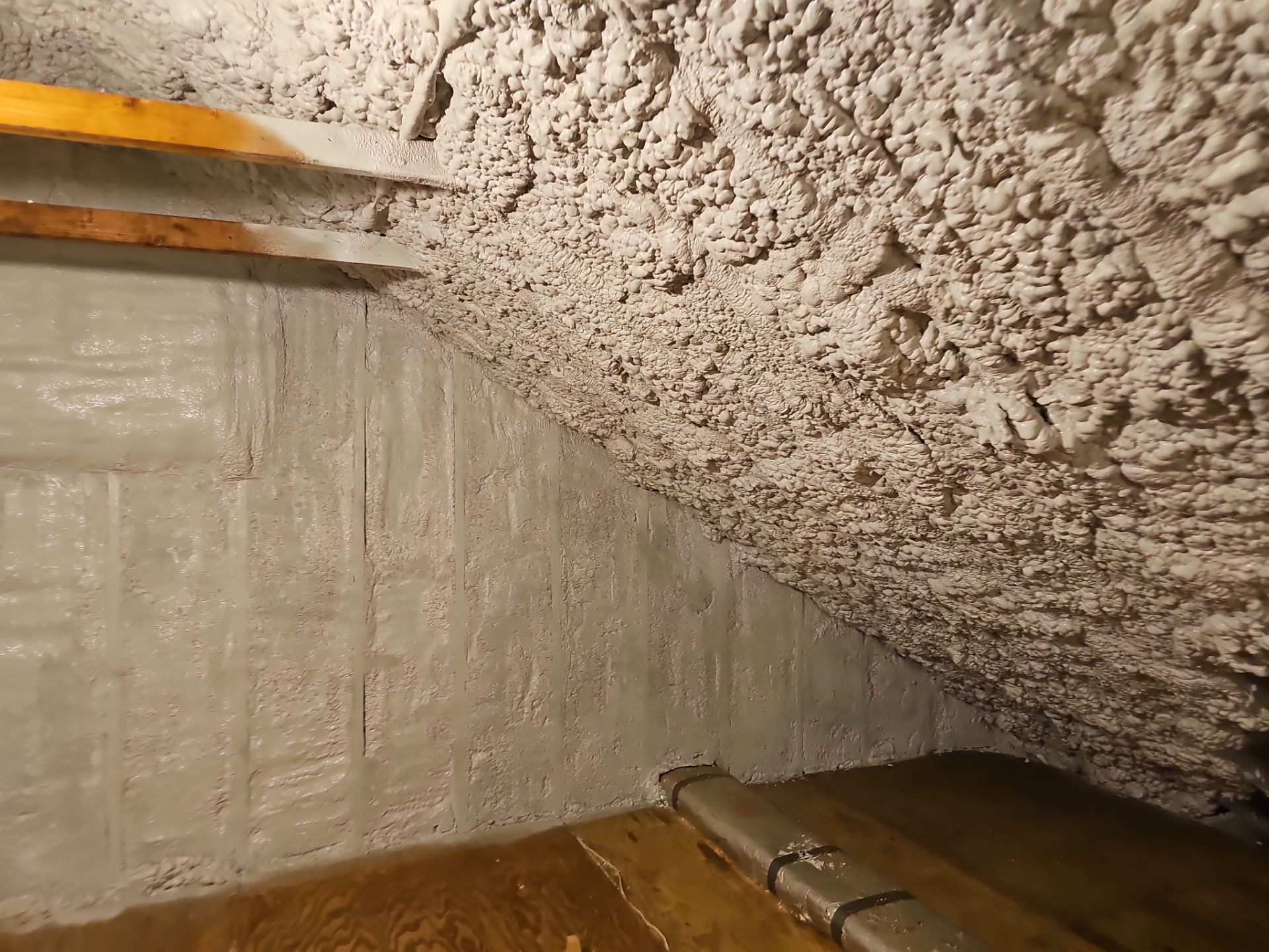 Attic Retrofit using open cell spray foam by NYS Foam & Energy