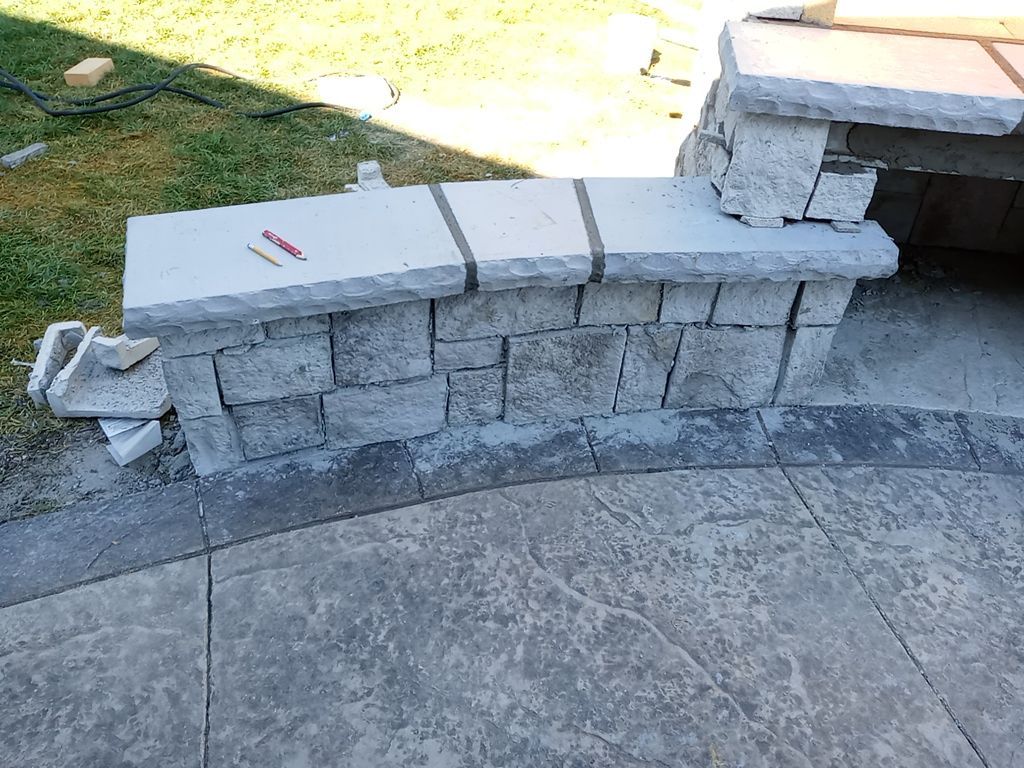 Back Yard Fireplace and Landscape by LAND ESCAPES LLC