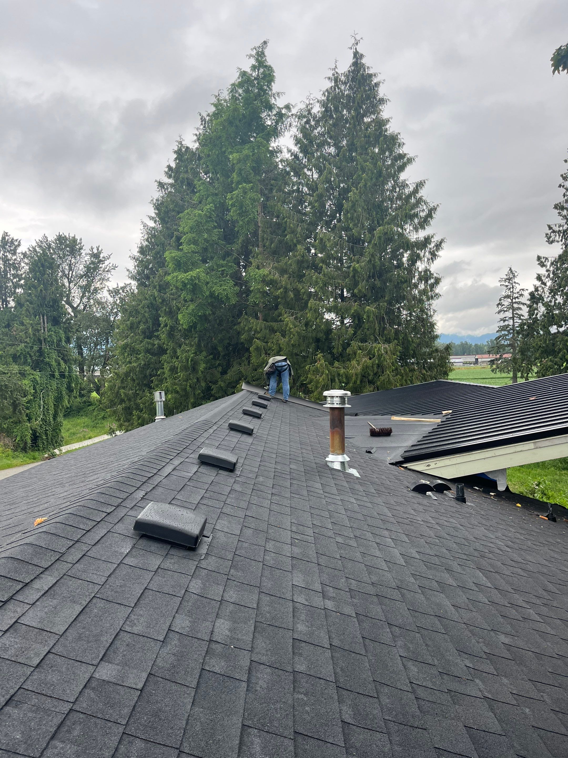 Residential Roofing Installation using 12" Prolok metal, shingles and Torch on roofing by Top Notch Roofing Inc