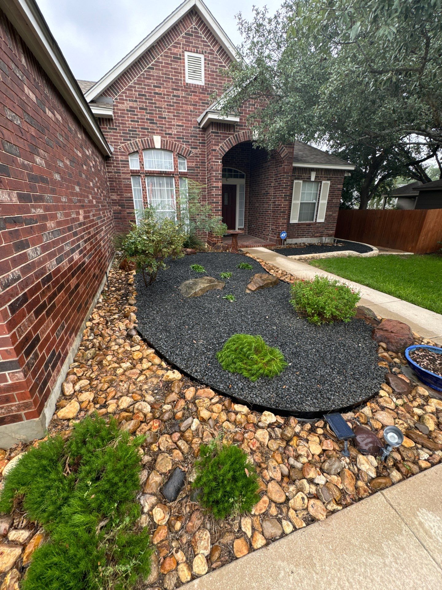 Landscaping Enhancement  using Texas Black Gravel by Hole In One Lawns, LLC