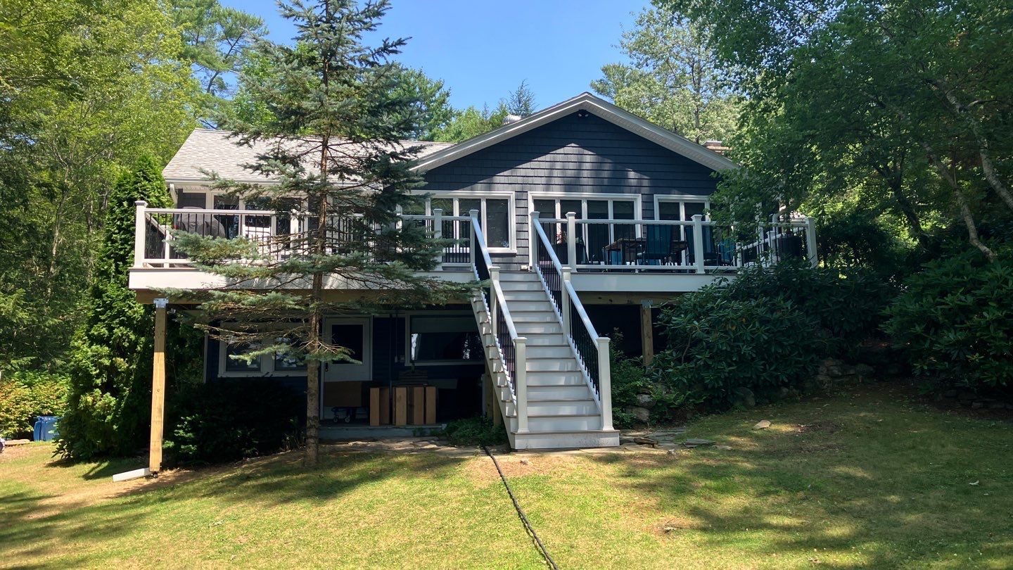 Deck replacement using Trex Transcend Rope Swing and Transcend Railings.Trex Rainescape by DiGiorgi Roofing and Siding Inc