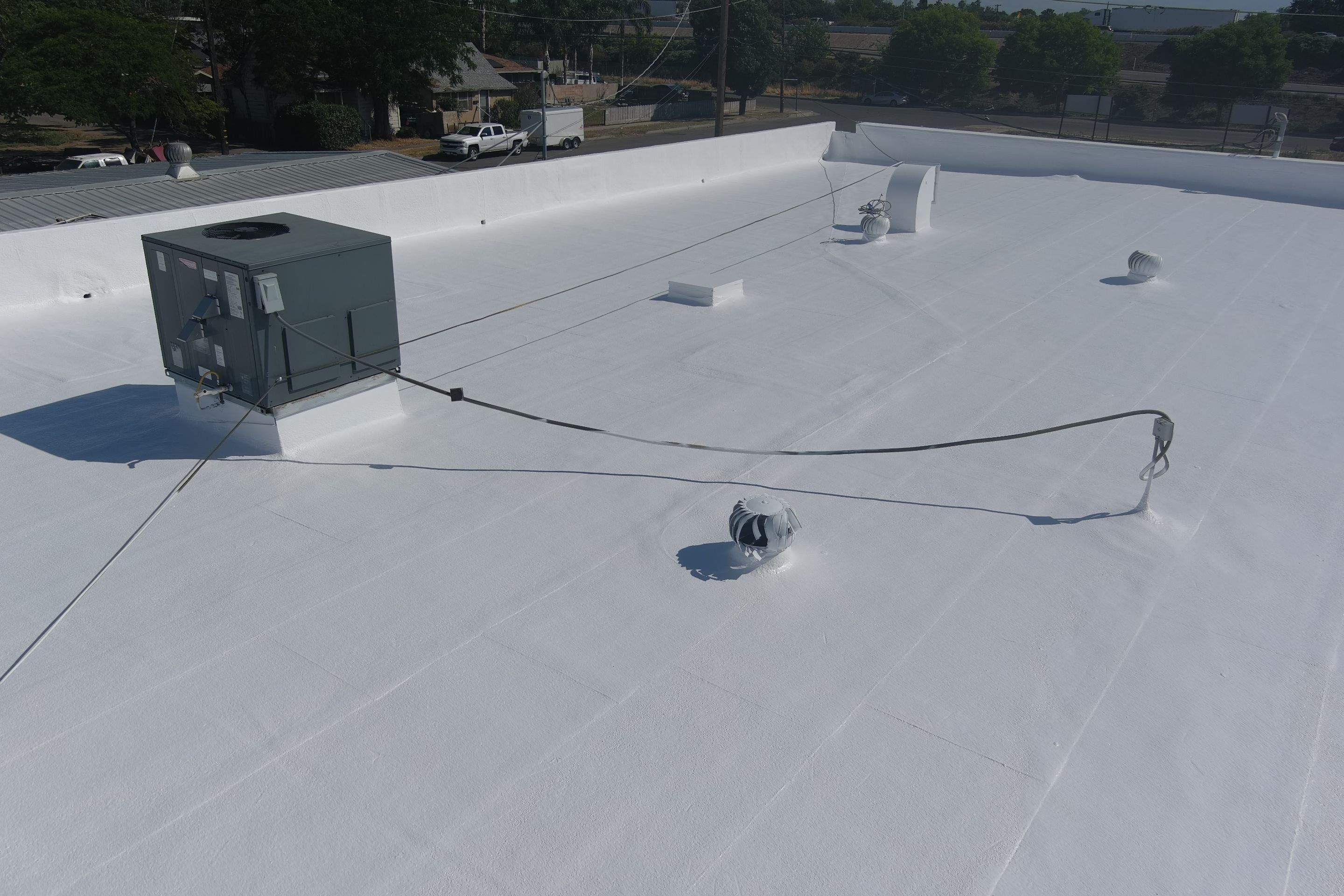 Spray foam and coatings using Conklin Benchmark/PUMA XL coatings and spray foam by Straight Edge Roofing Inc