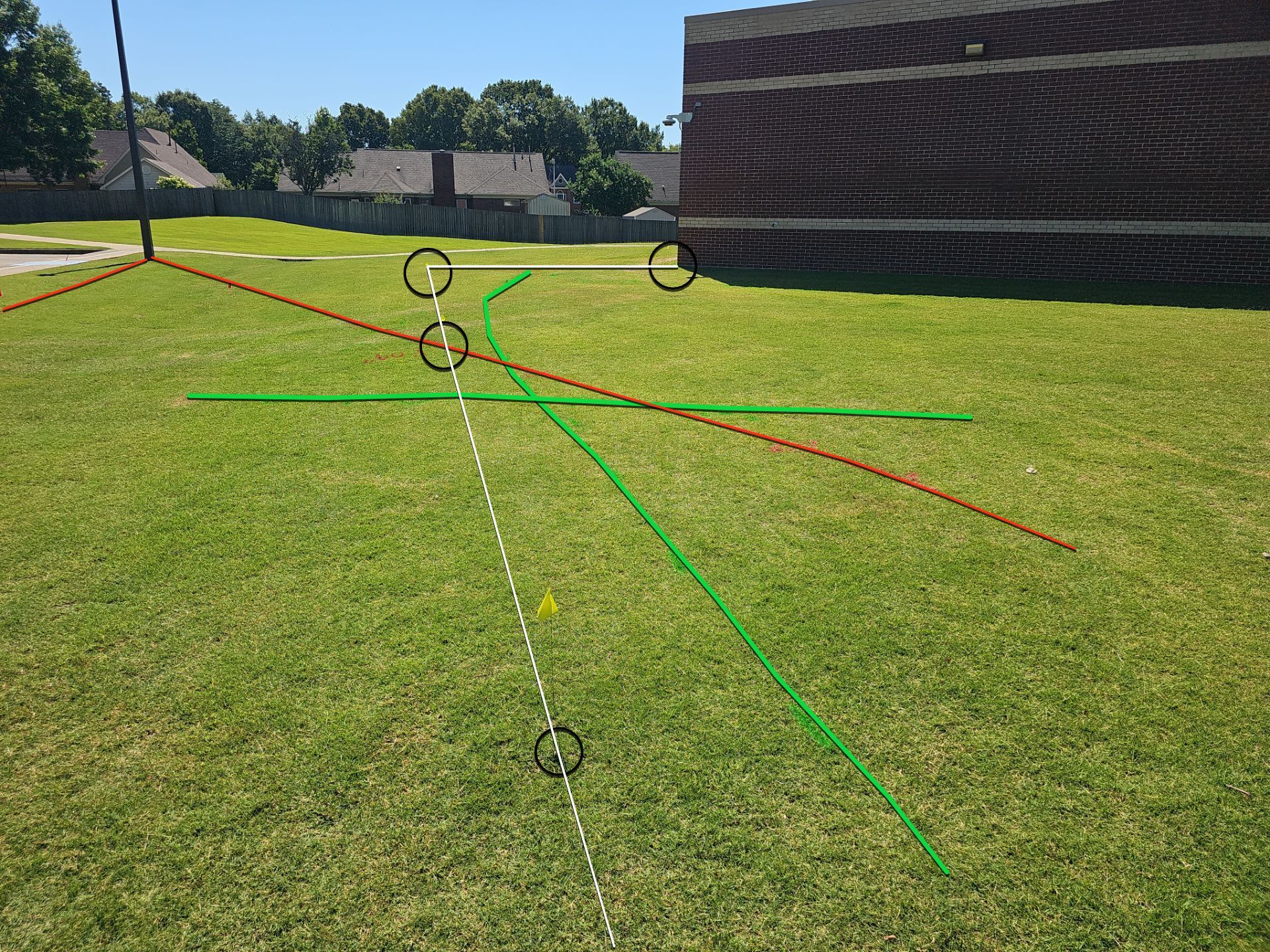 Utility Locating at a school for fence install by Alsip Locating Service, LLC
