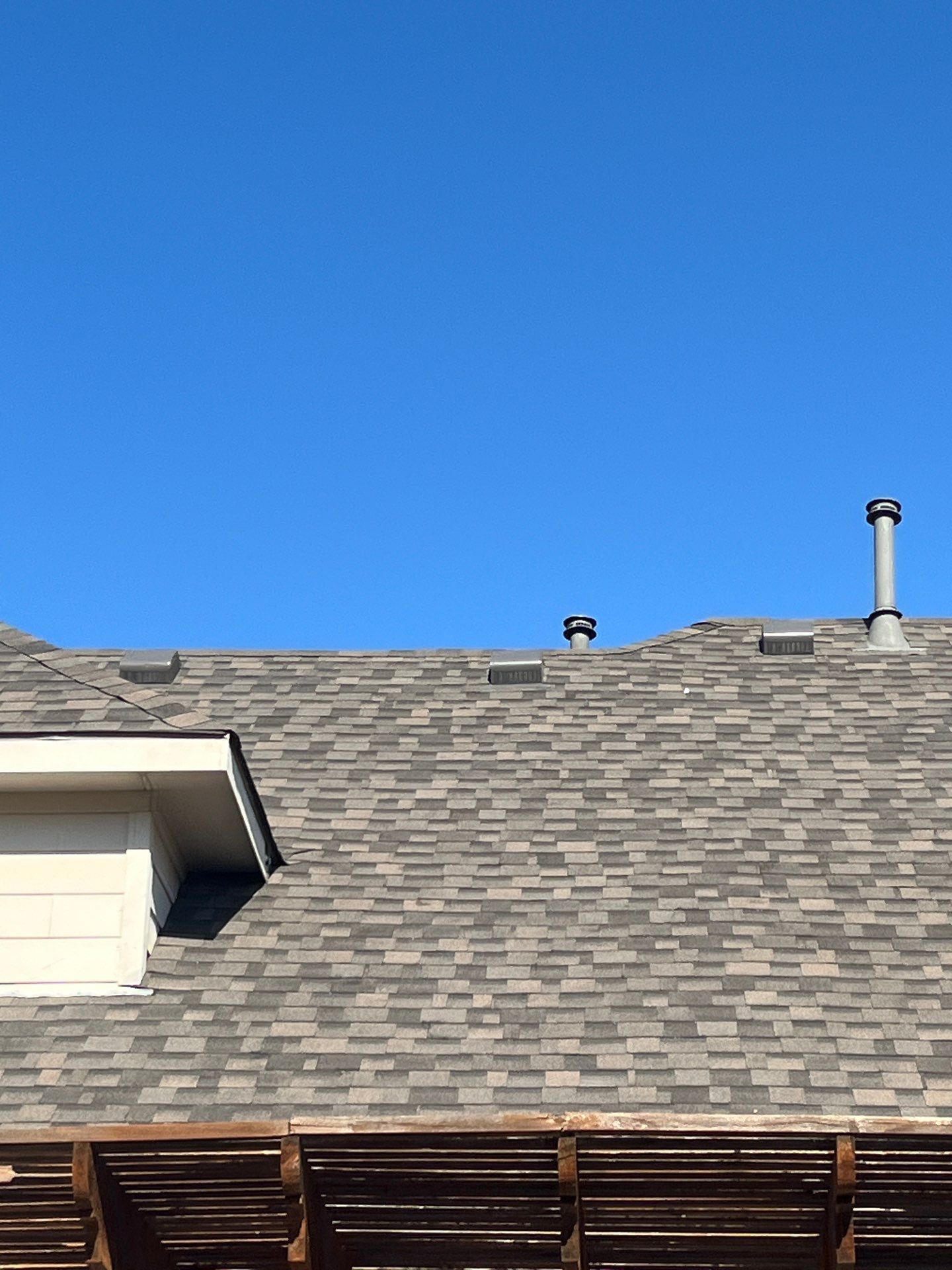 IKO Cornerstone-Dark Reddish Brown brick house  by Tejas Roofworks + Restoration