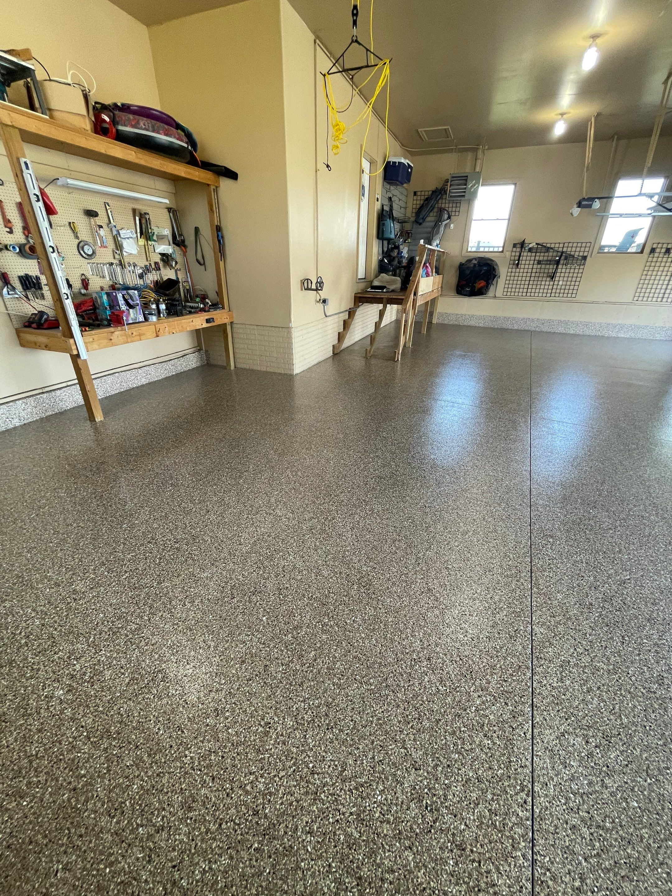 Residential Garage Floor Transformation with Speckled Epoxy Coating by Select Painting, Coatings & Garage Cabinets