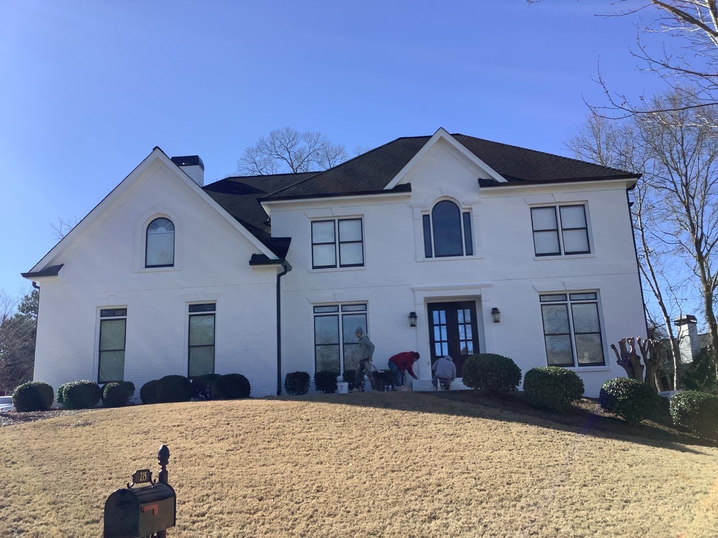 White Brick Exterior Painting and Deck Refinishing in Duluth by Swift Home Renovations
