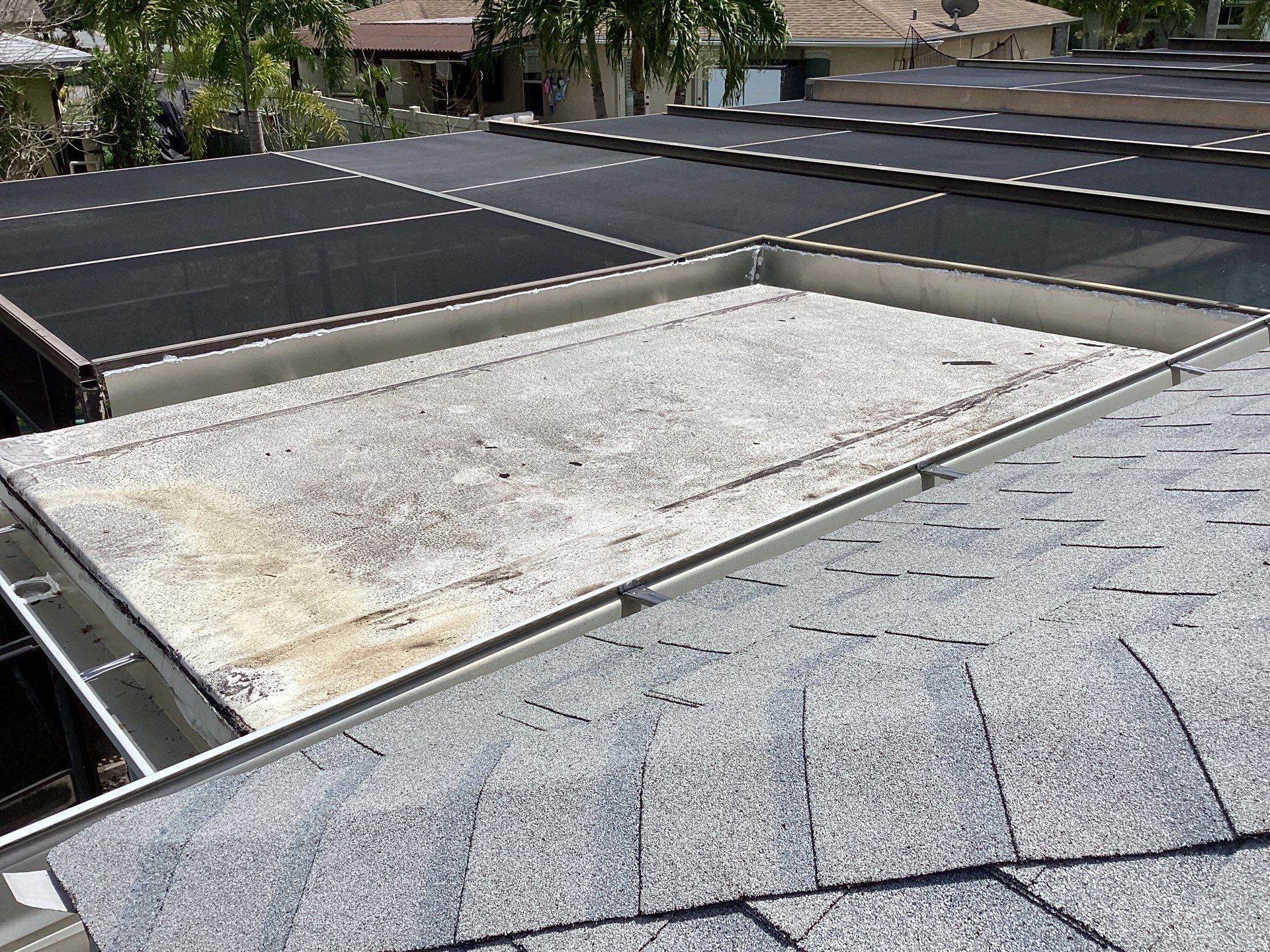 White Seamless Gutters and Splash Guards in Fort Myers FL by Gutter Professor by Gutter Professors