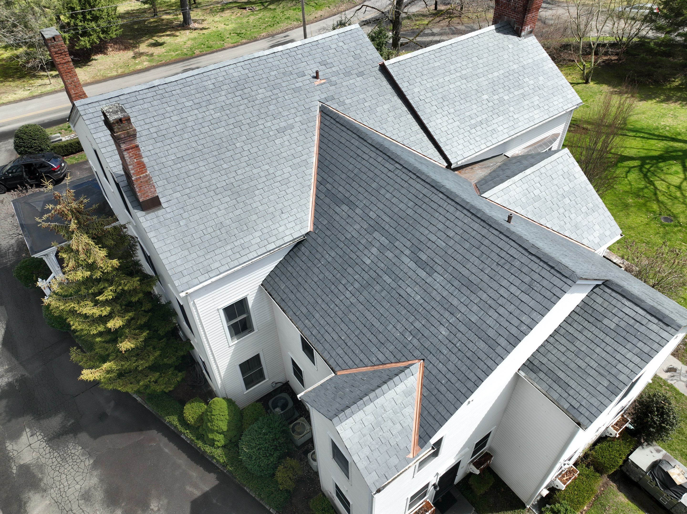 Residential Roofing Installation using Vermont Slate by A Plus Exterior