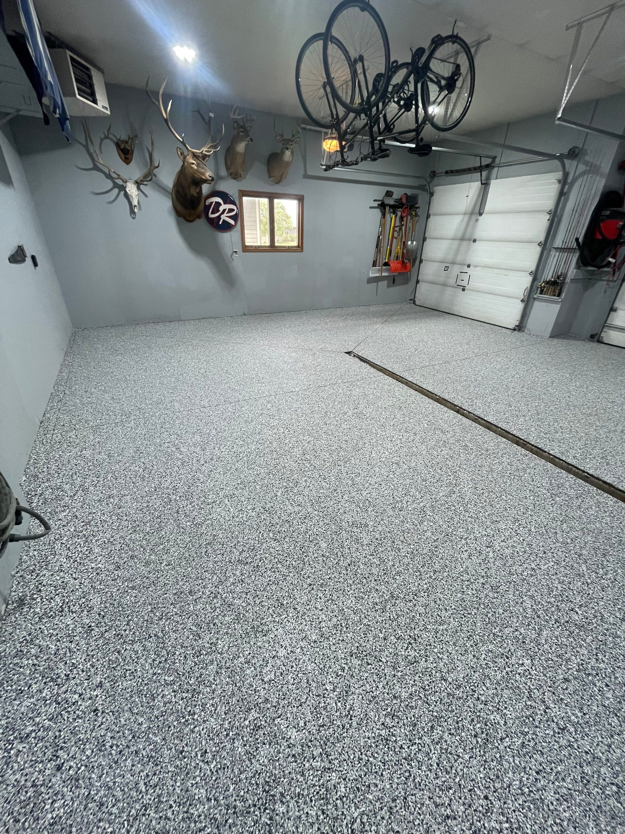 Full Garage Floor Epoxy Coating Installation in Dell Rapids by Select Painting, Coatings & Garage Cabinets