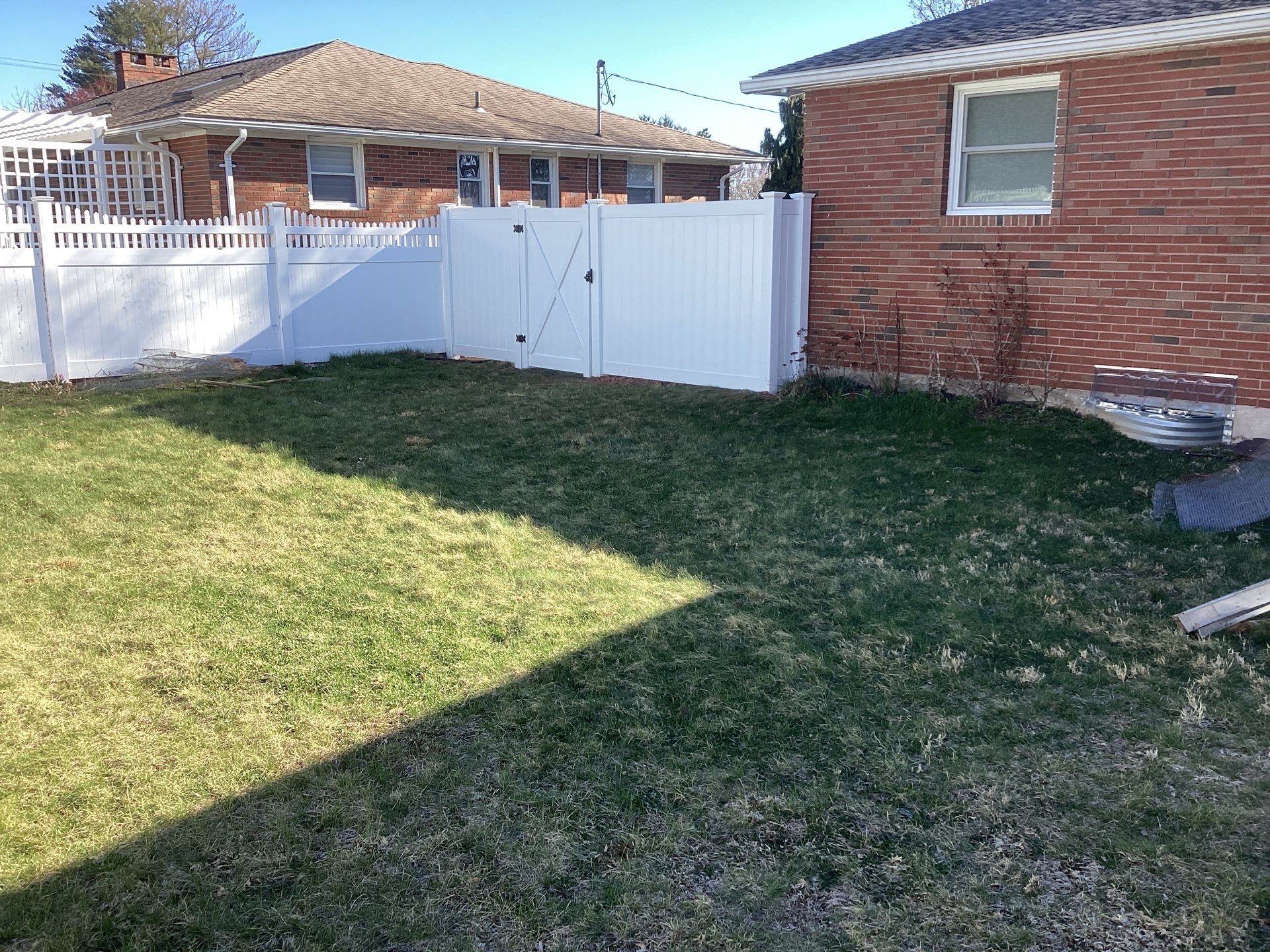 Fence replacement using White Vinyl Privacy with matching Gates.  by DiGiorgi Roofing and Siding Inc
