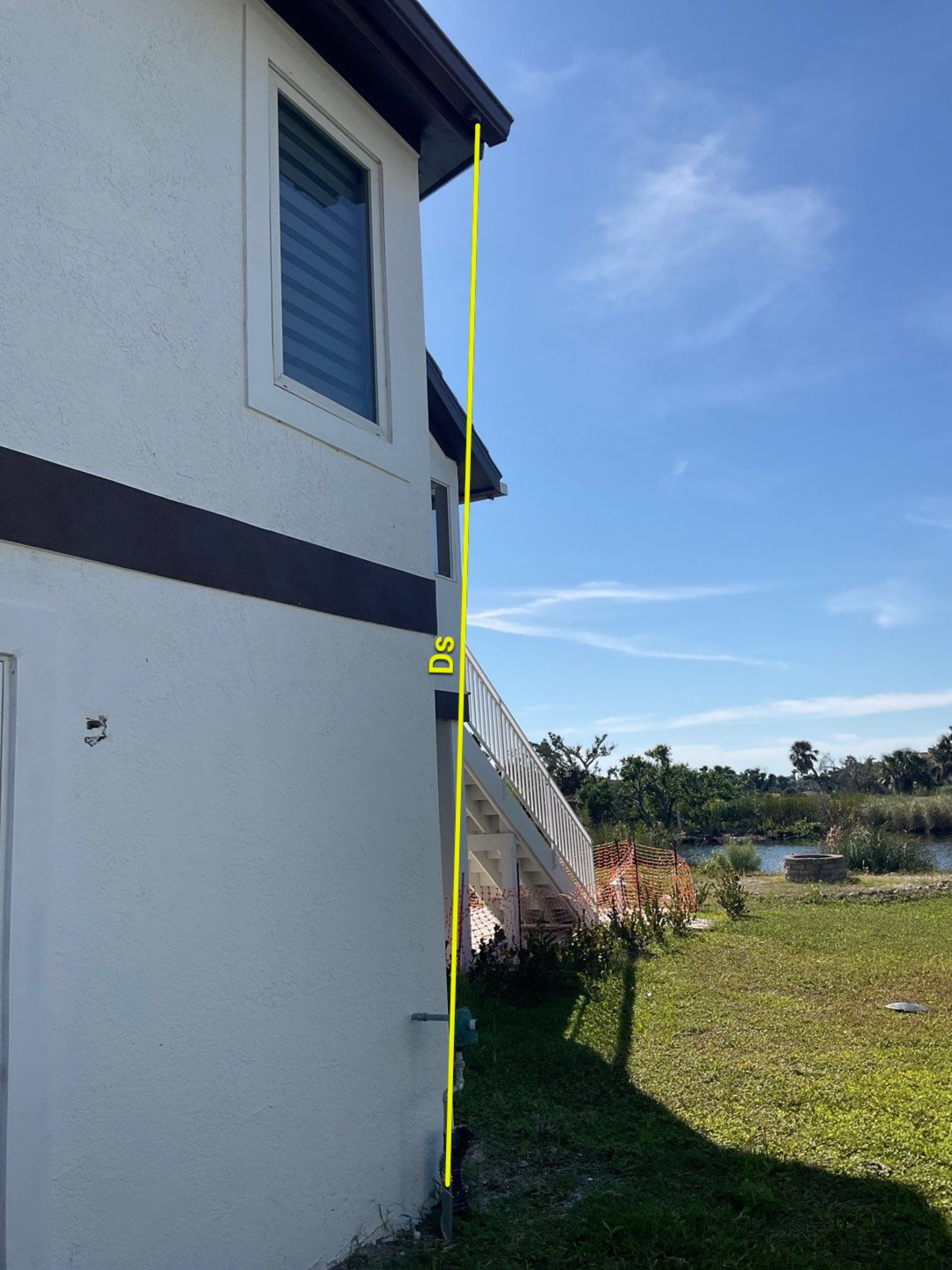 Musket Brown 7-Inch Gutters and White Down Spouts in Sanibel FL by Gutter Professors