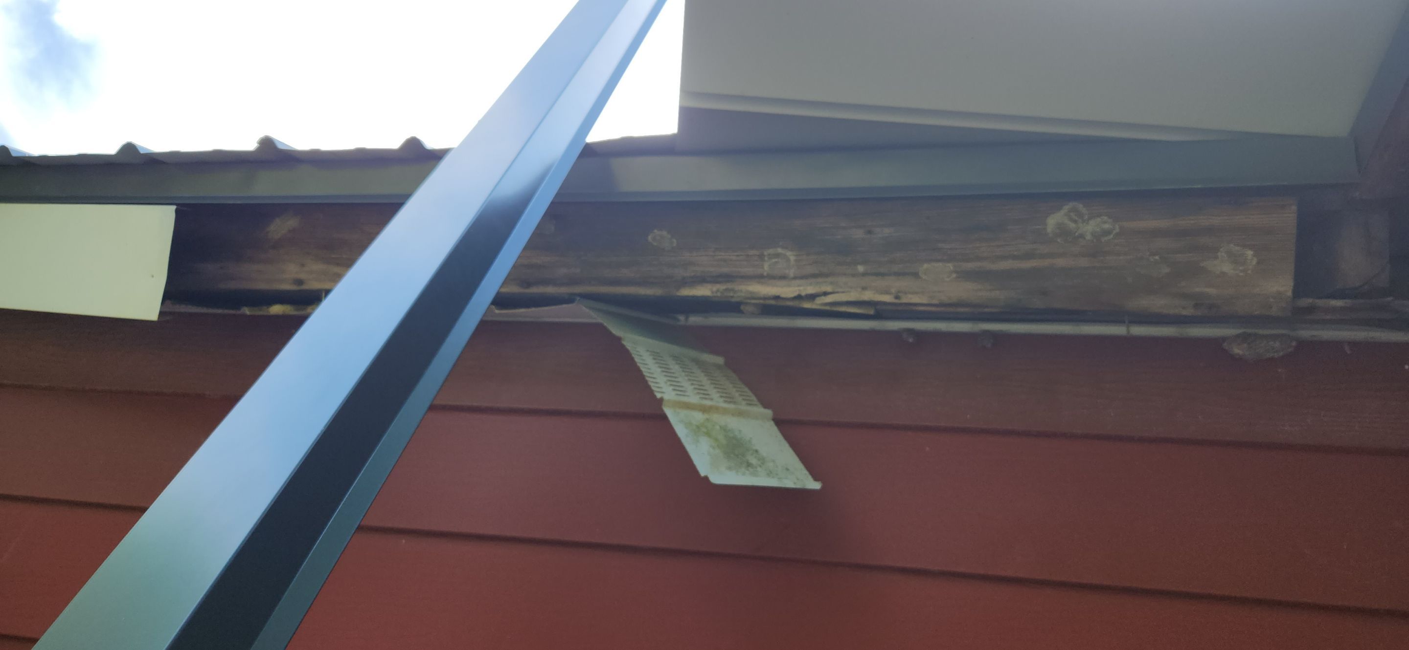 Residential Roofing Installation using 26 Gauge Colored Panels by Hostetler Roofing