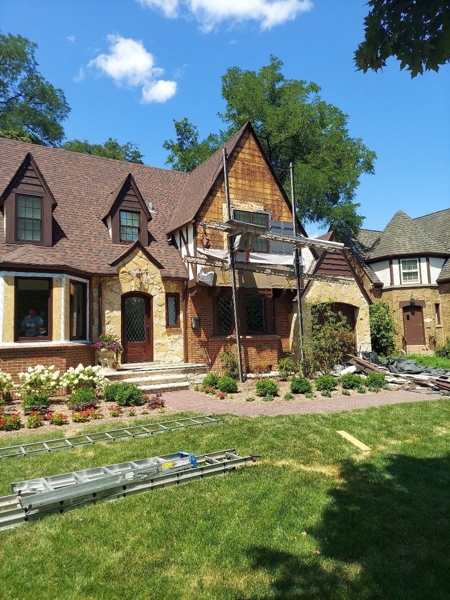 Tudor-Style Hardie Exterior Renovation in Elmhurst by Great American Exteriors