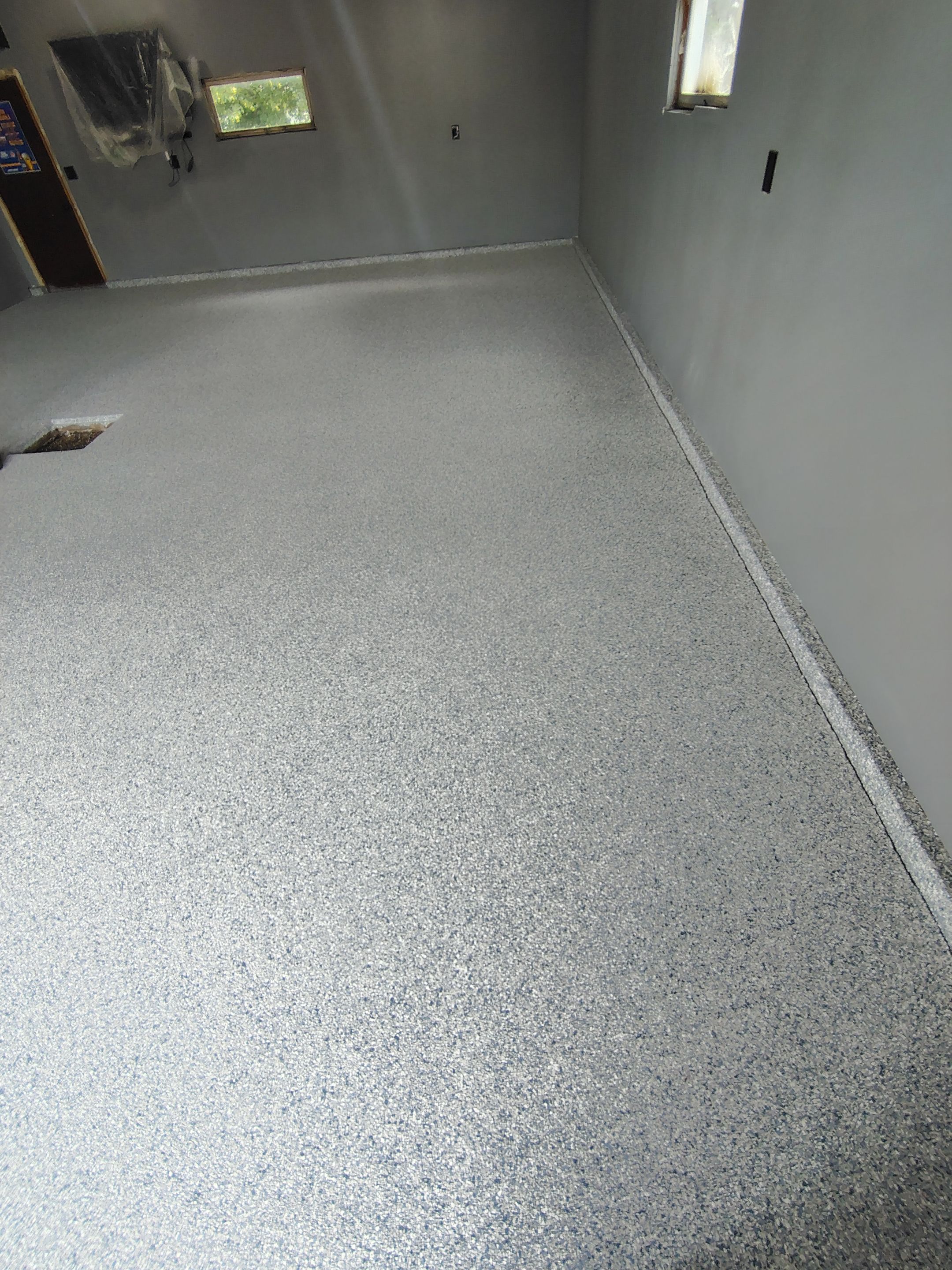 Garage Floor Concrete Coating and Surface Restoration in Colman by Select Painting, Coatings & Garage Cabinets